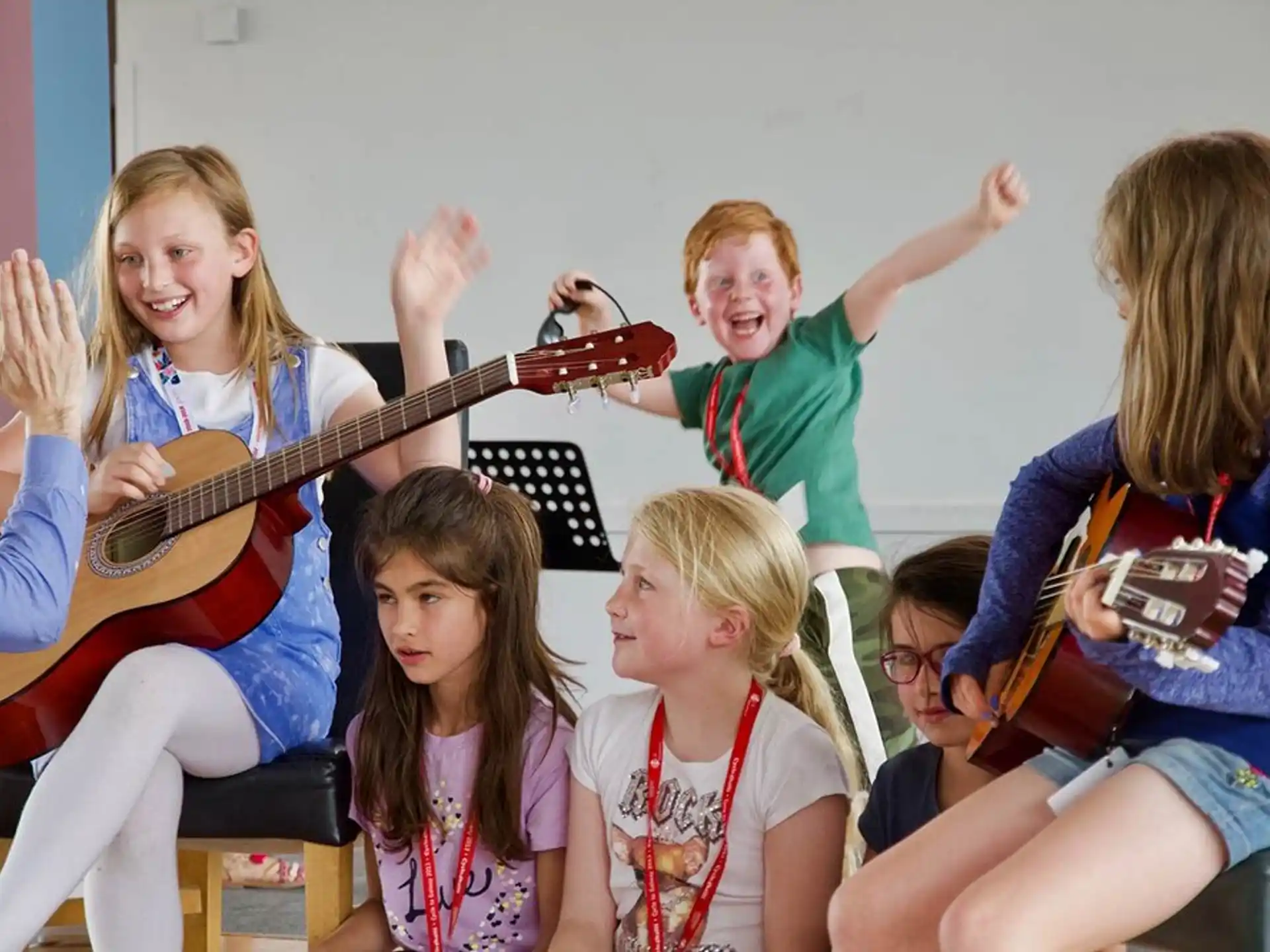 a group of people sitting and playing instruments