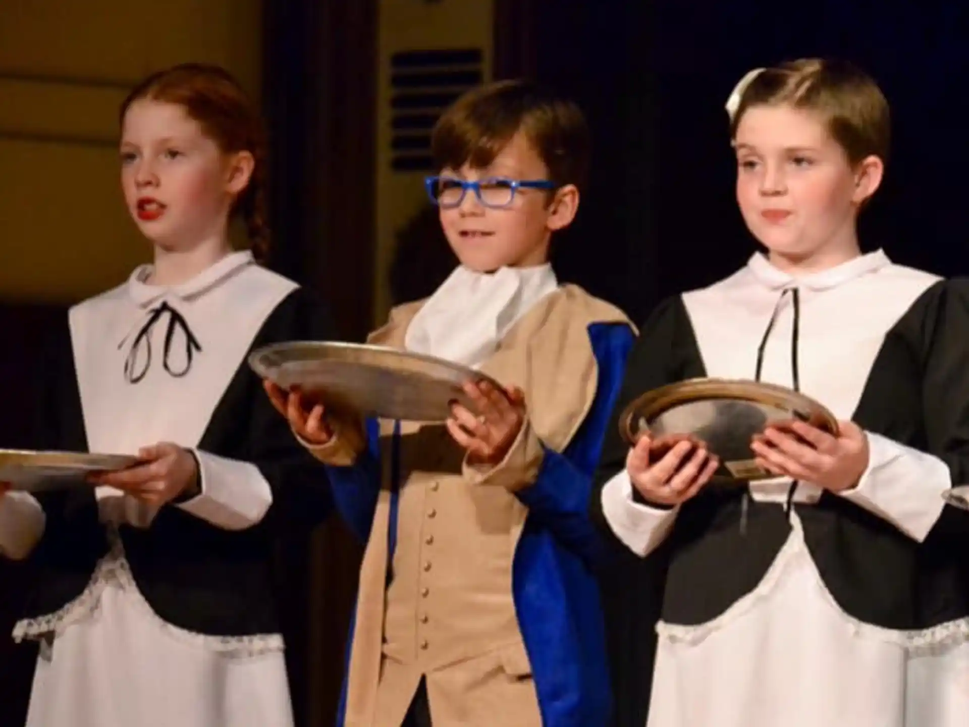 a group of kids wearing clothing