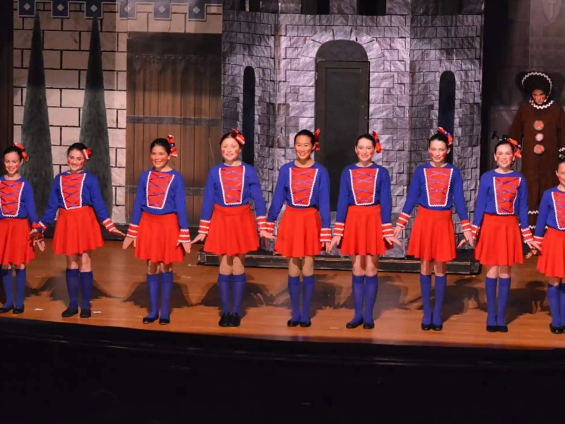 a group of people in clothing on a stage
