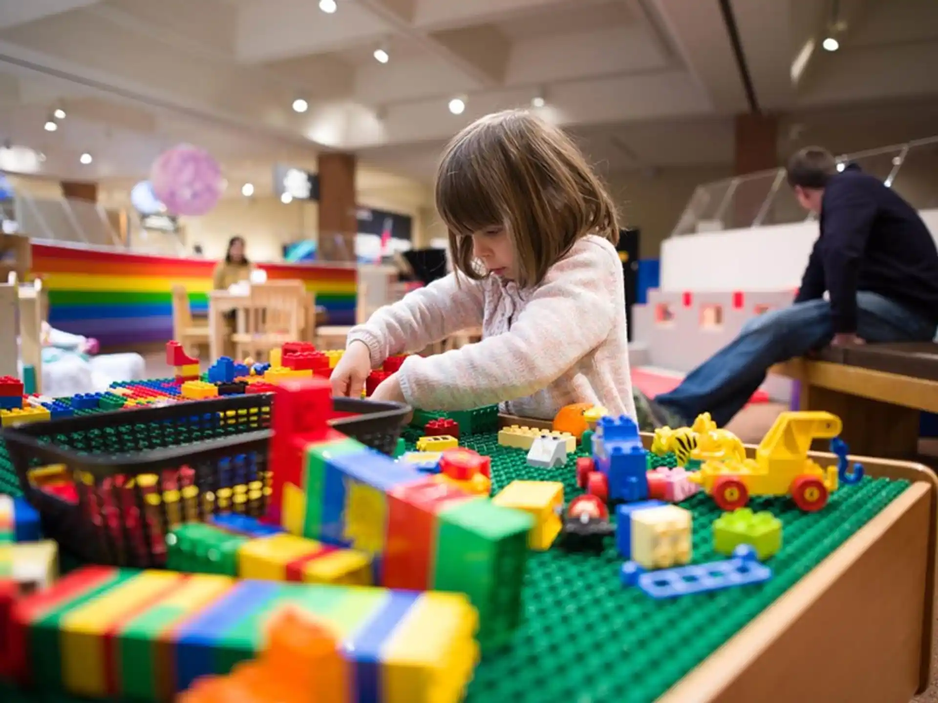 a person playing with toys