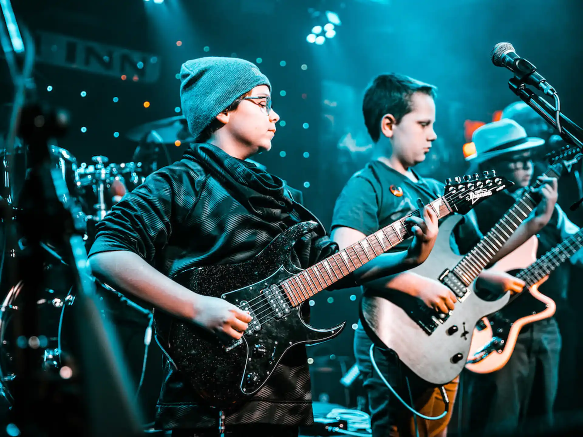 a group of men playing guitars