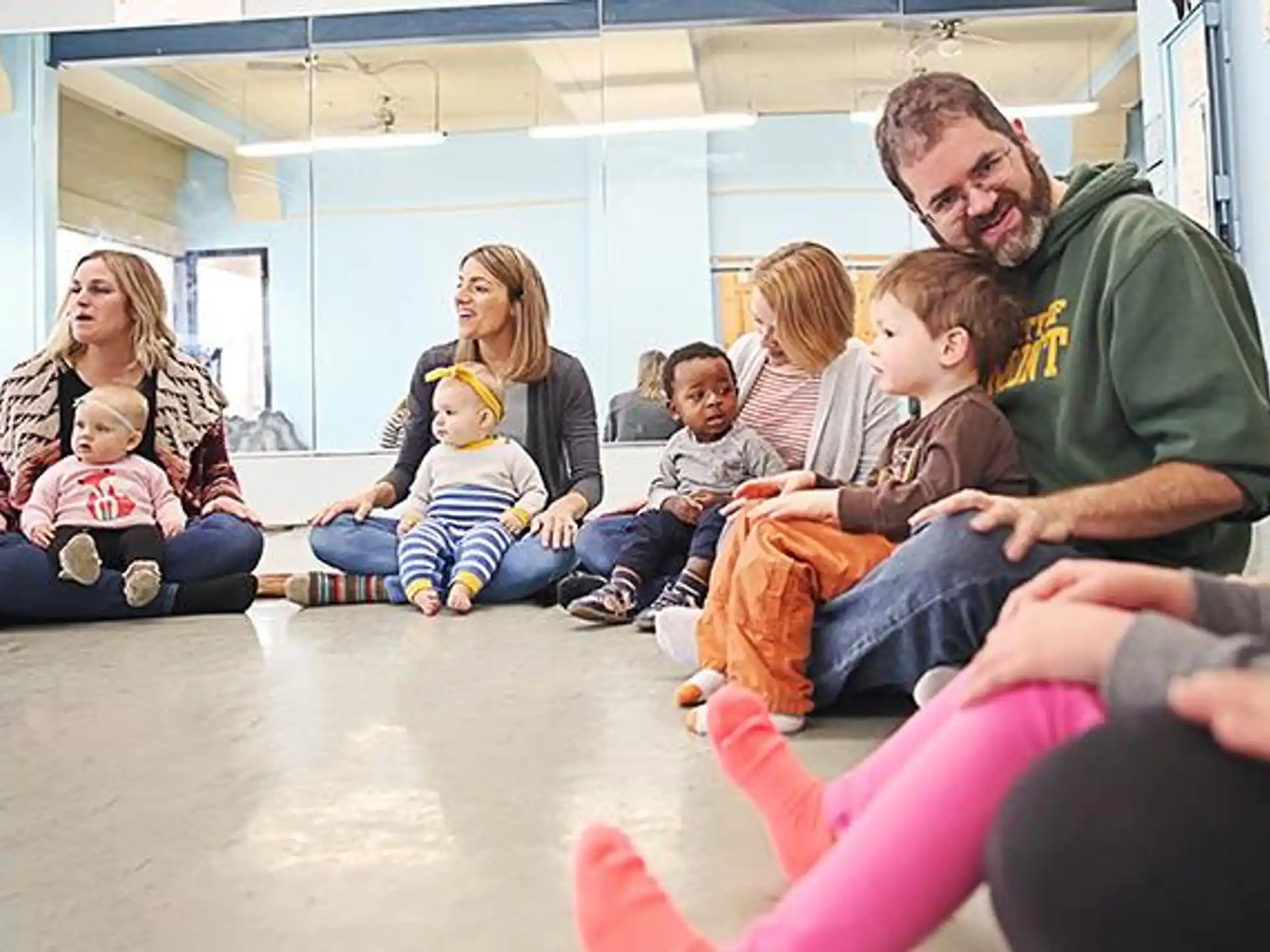 a group of people sitting on the floor