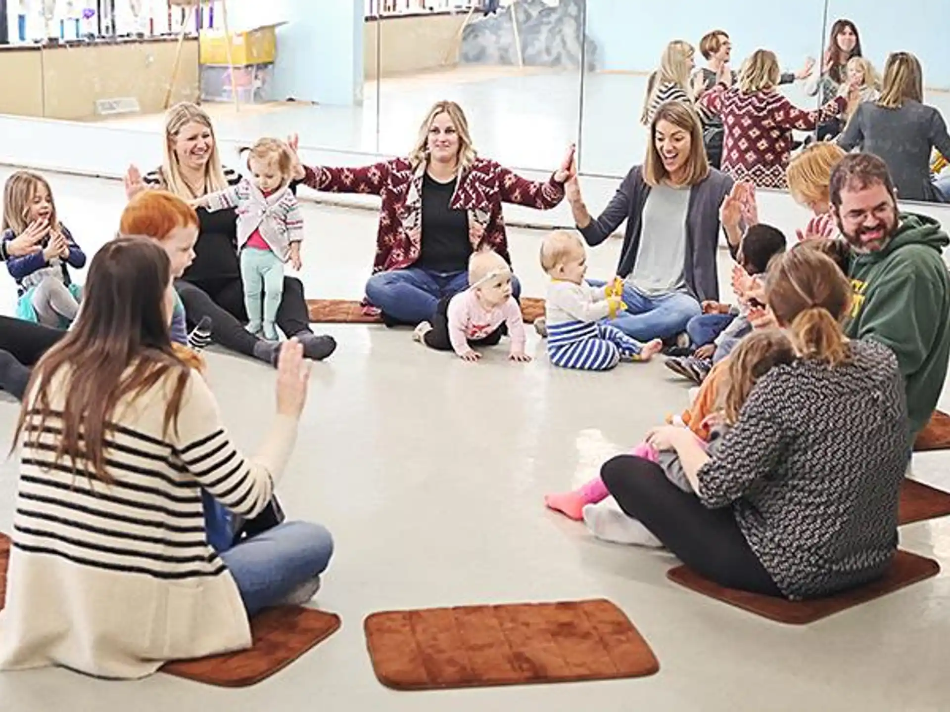 a group of people sitting on the floor