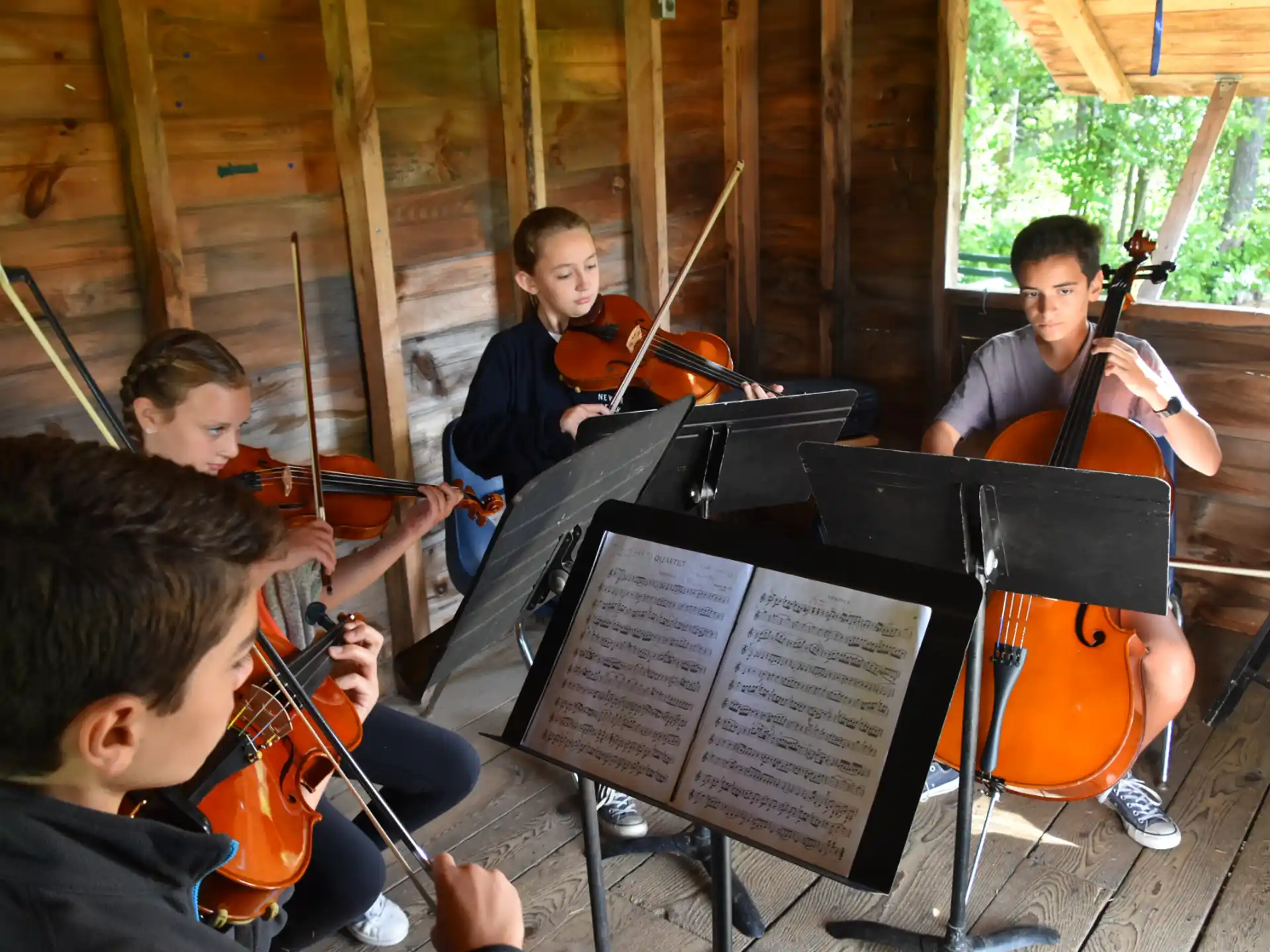 a group of kids playing instruments
