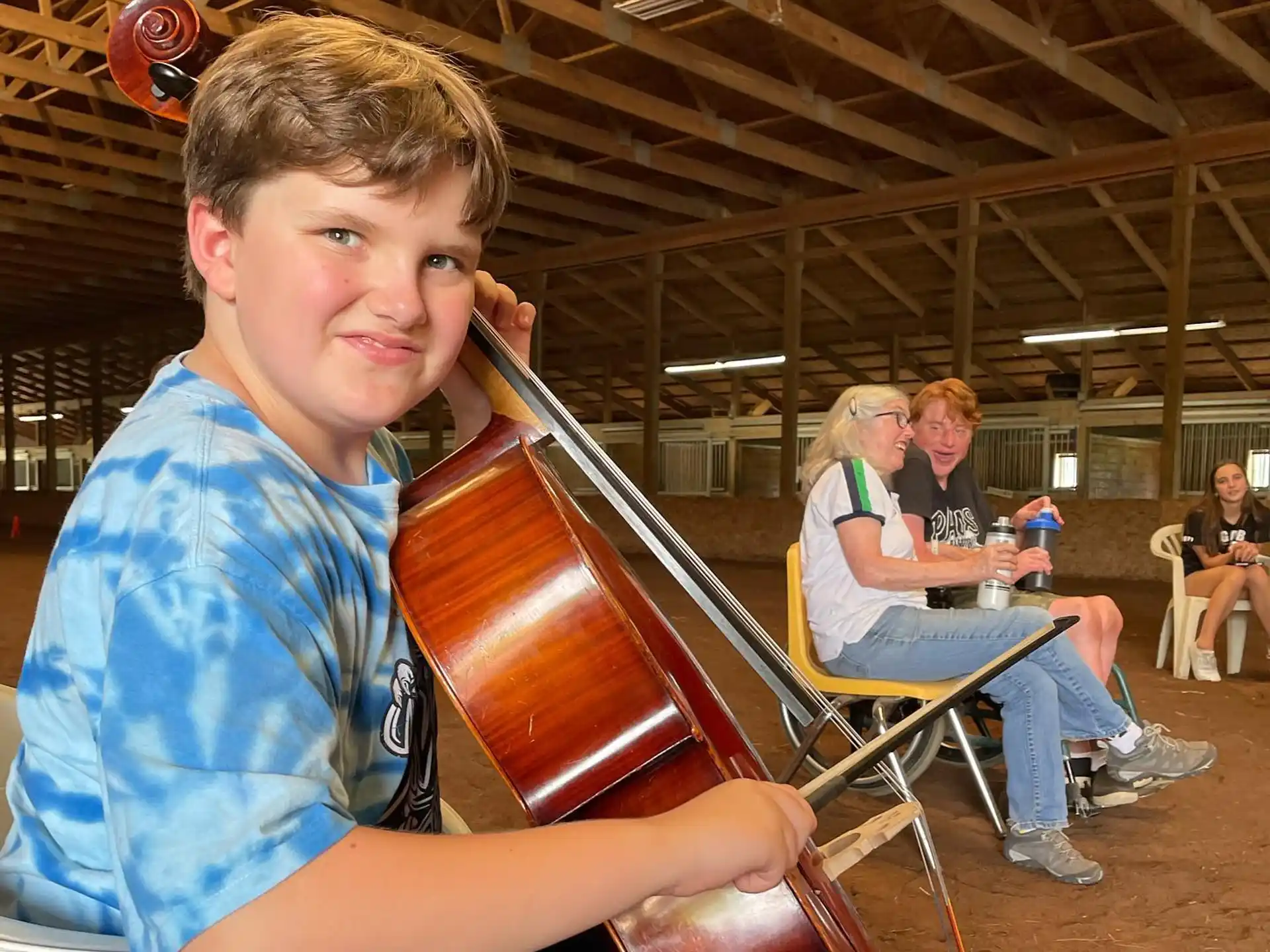 a boy holding a violin