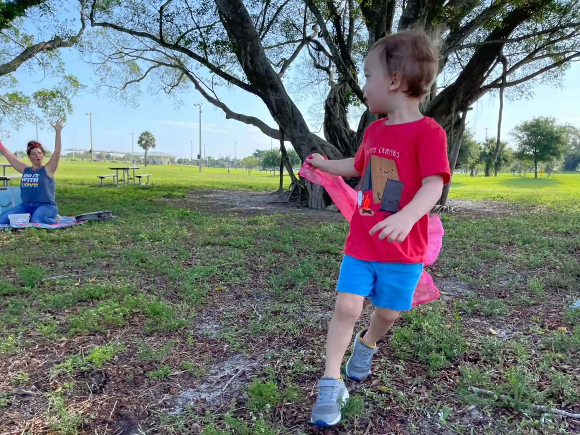 a boy running in a park