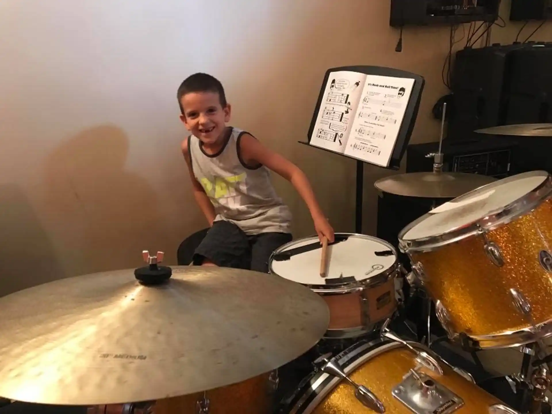 a boy playing drums