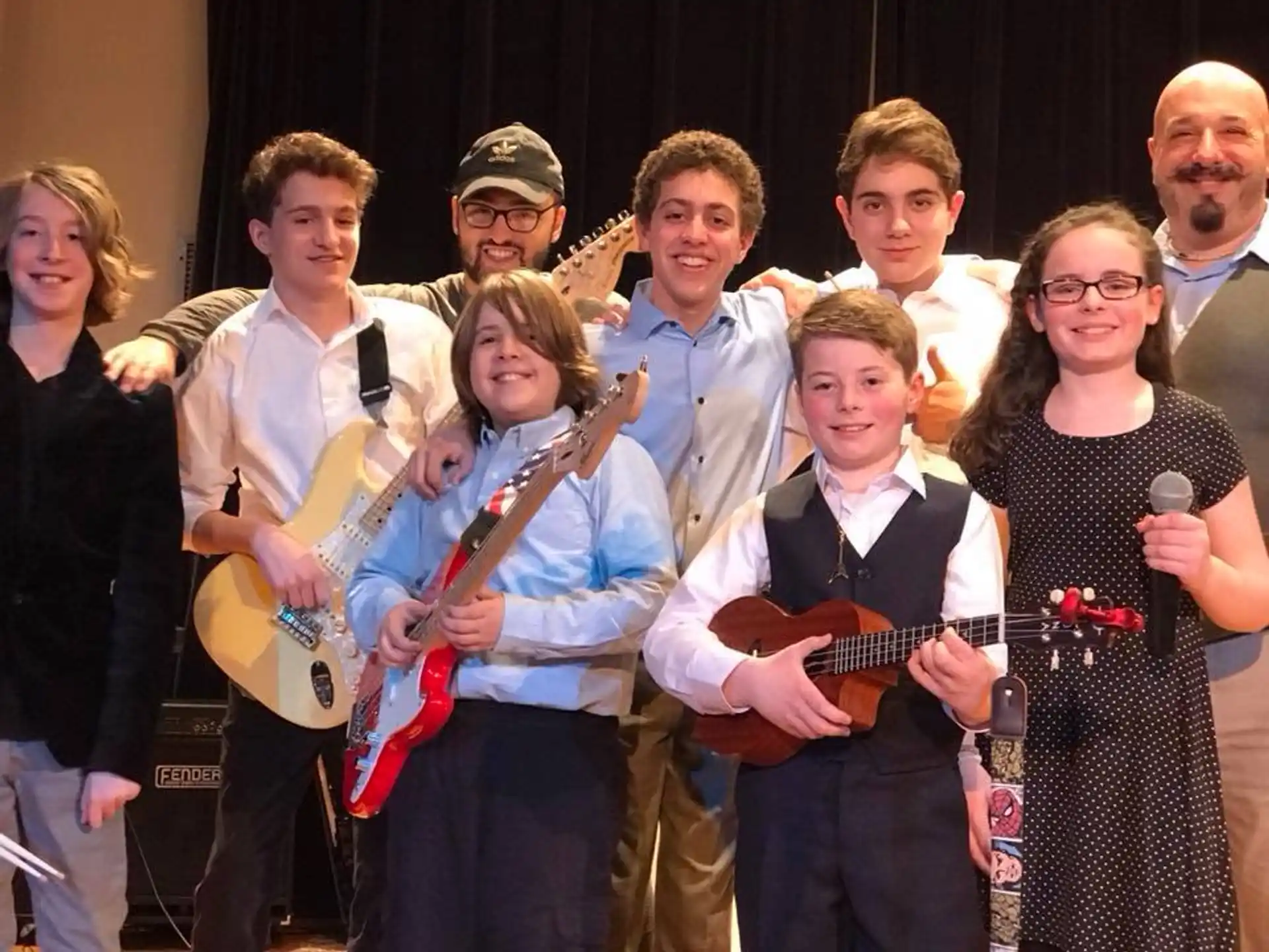 a group of people holding musical instruments