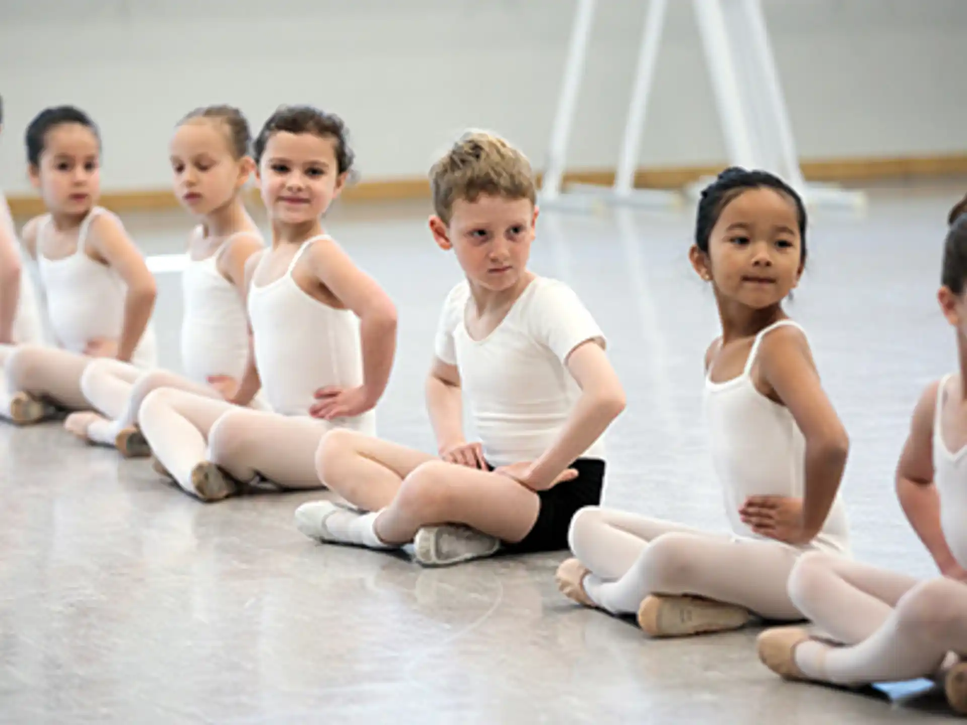 a group of children sitting on the floor