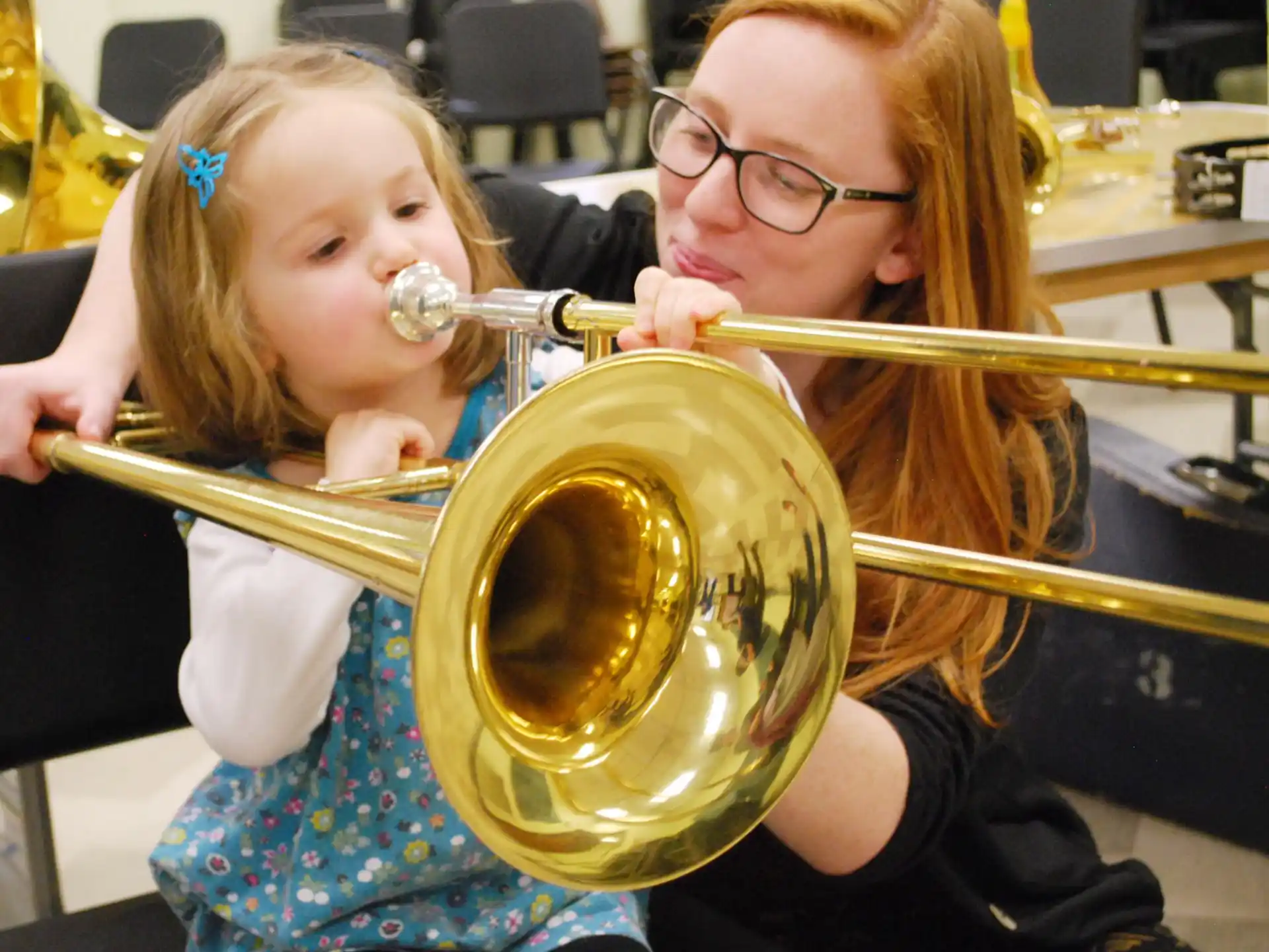 a couple of girls playing brass instruments