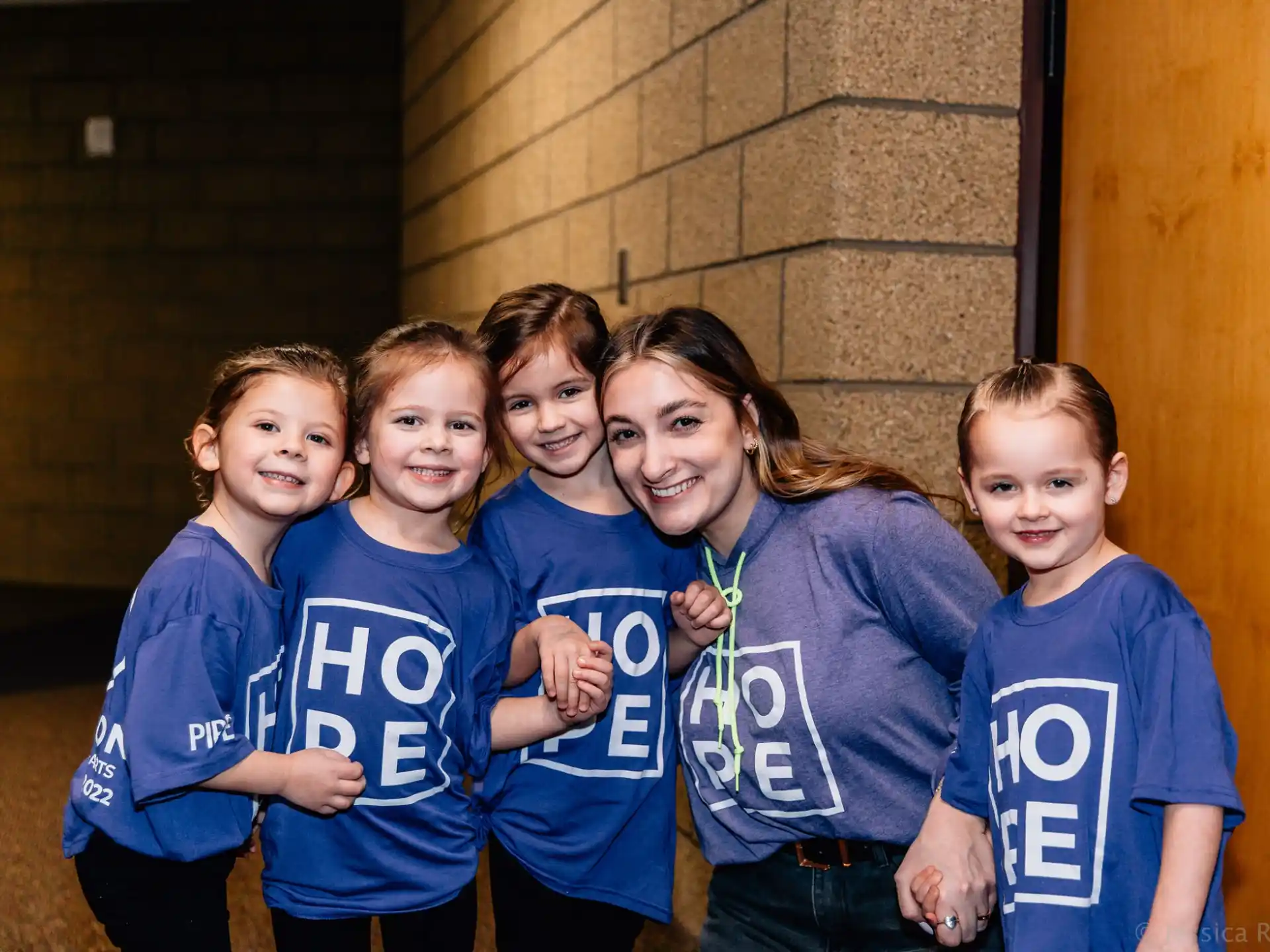 a group of children posing for a photo