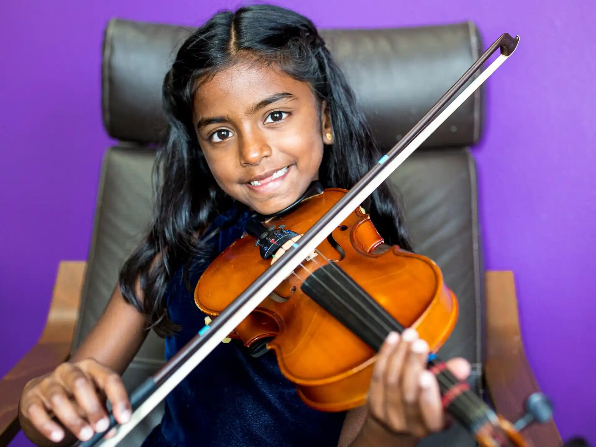 a person playing a violin