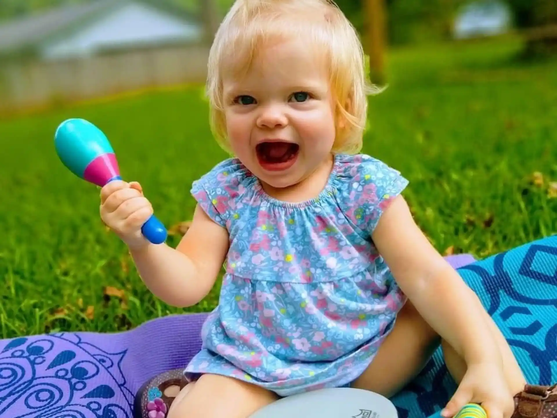 a baby holding a toy