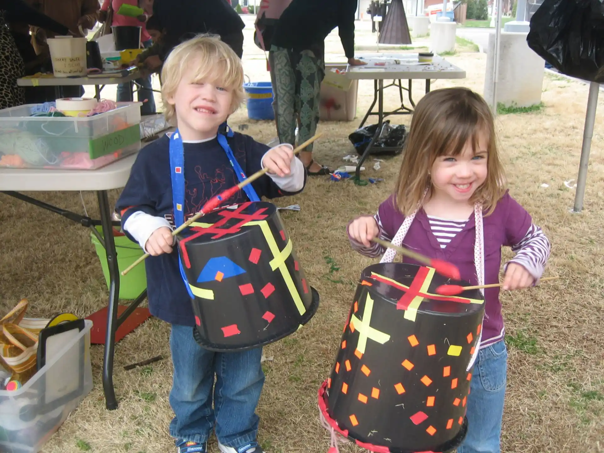a couple of children holding shopping bags