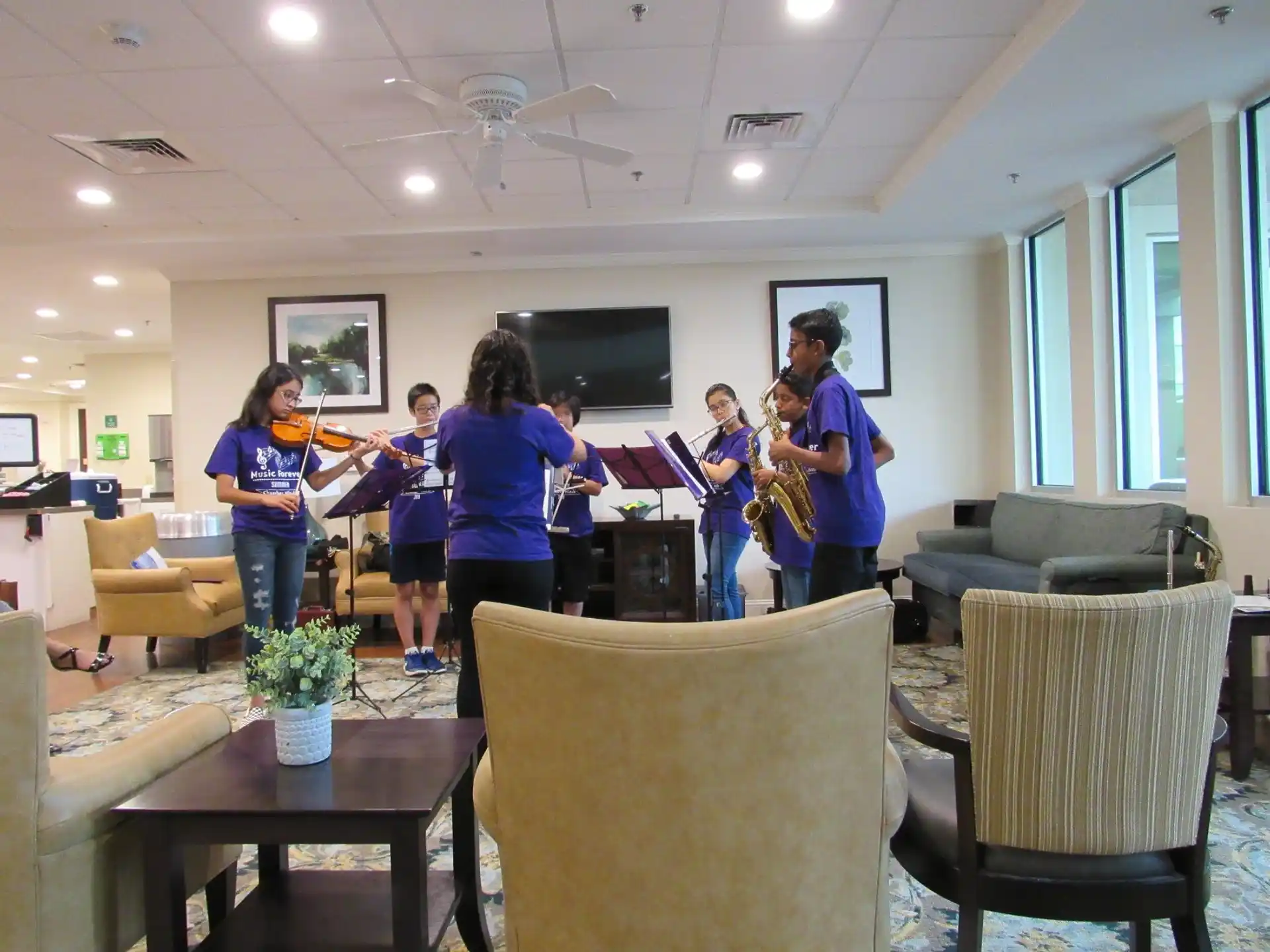 a group of people holding instruments