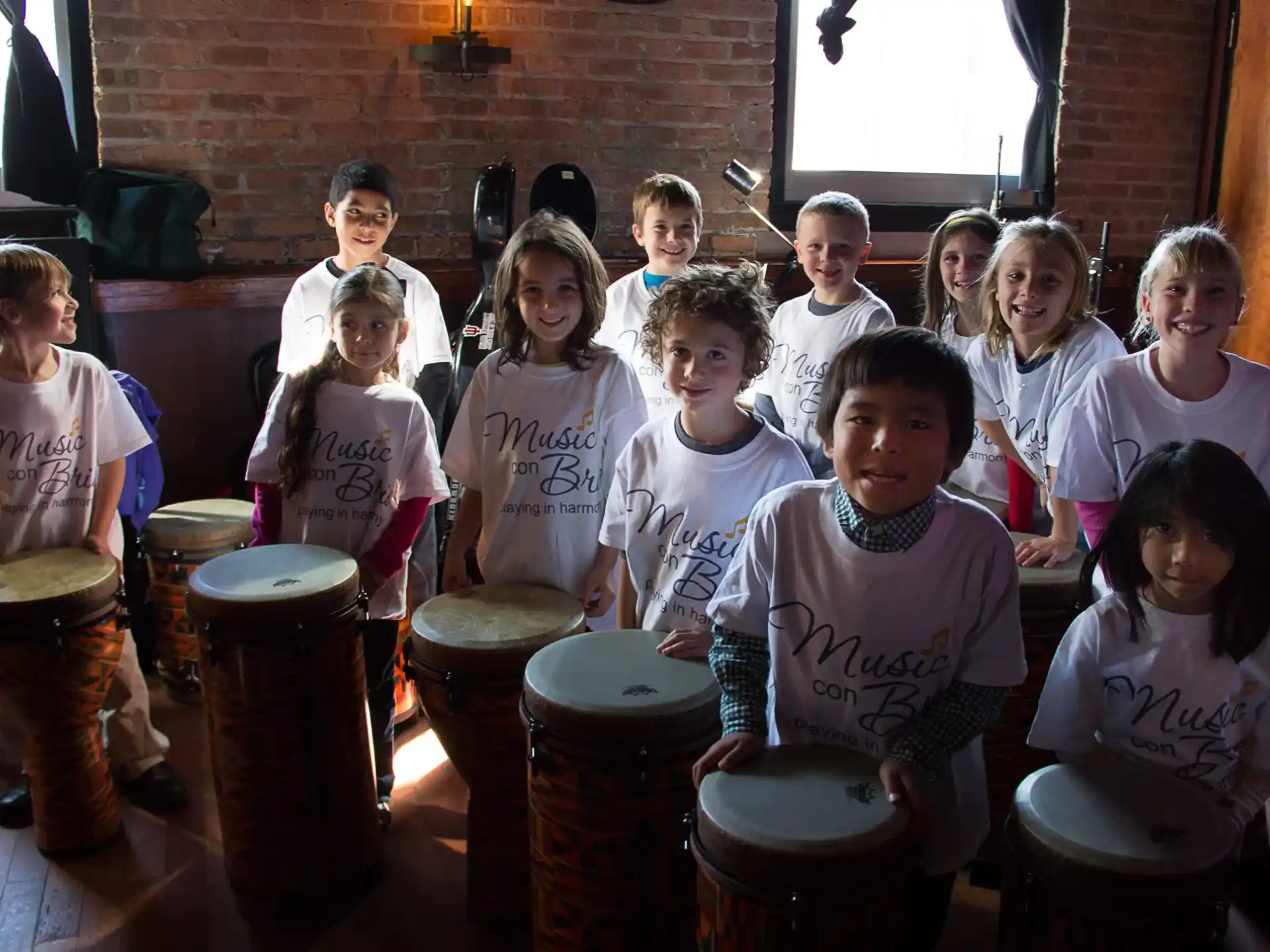 a group of children playing drums