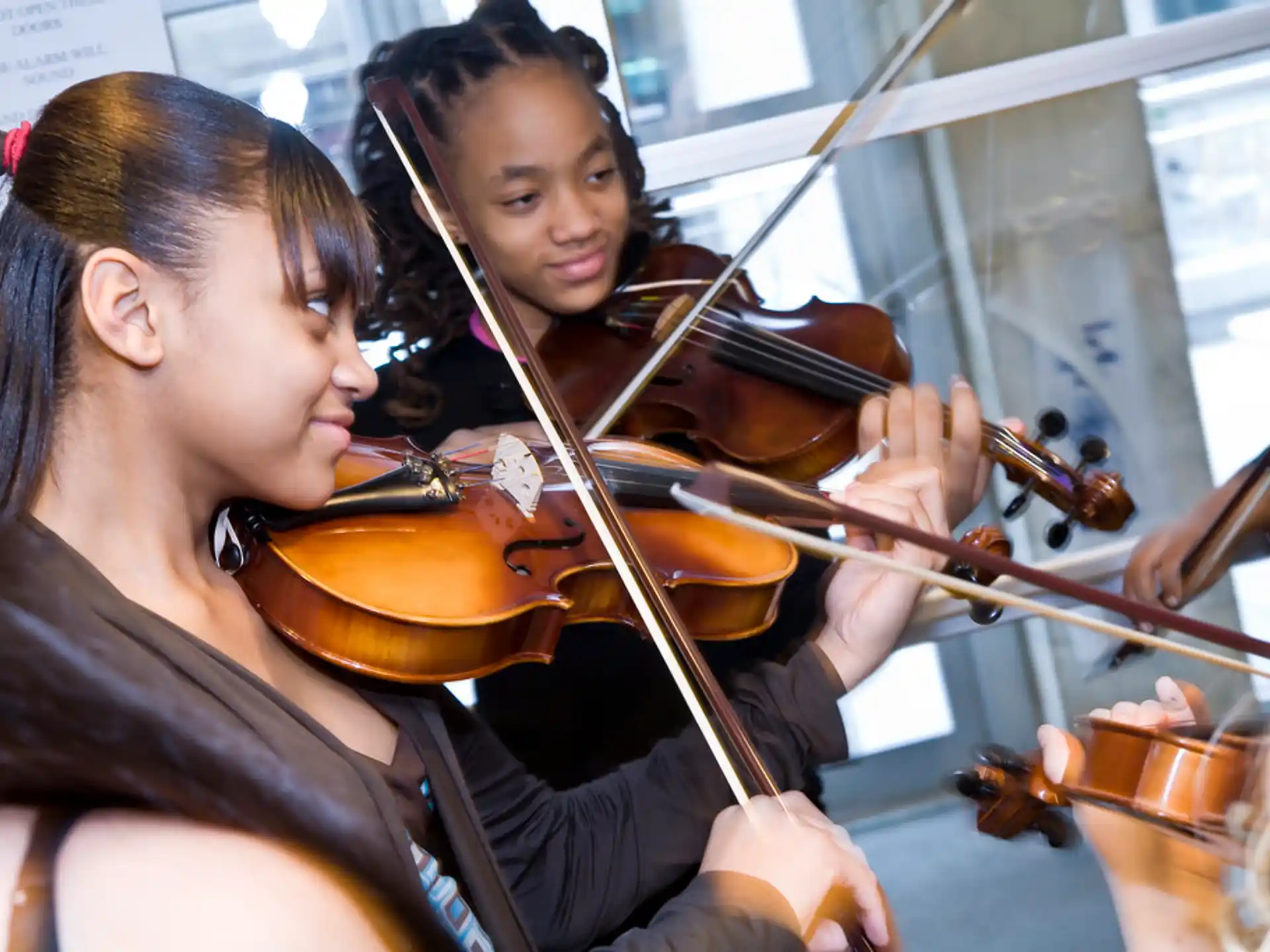 a woman playing a violin