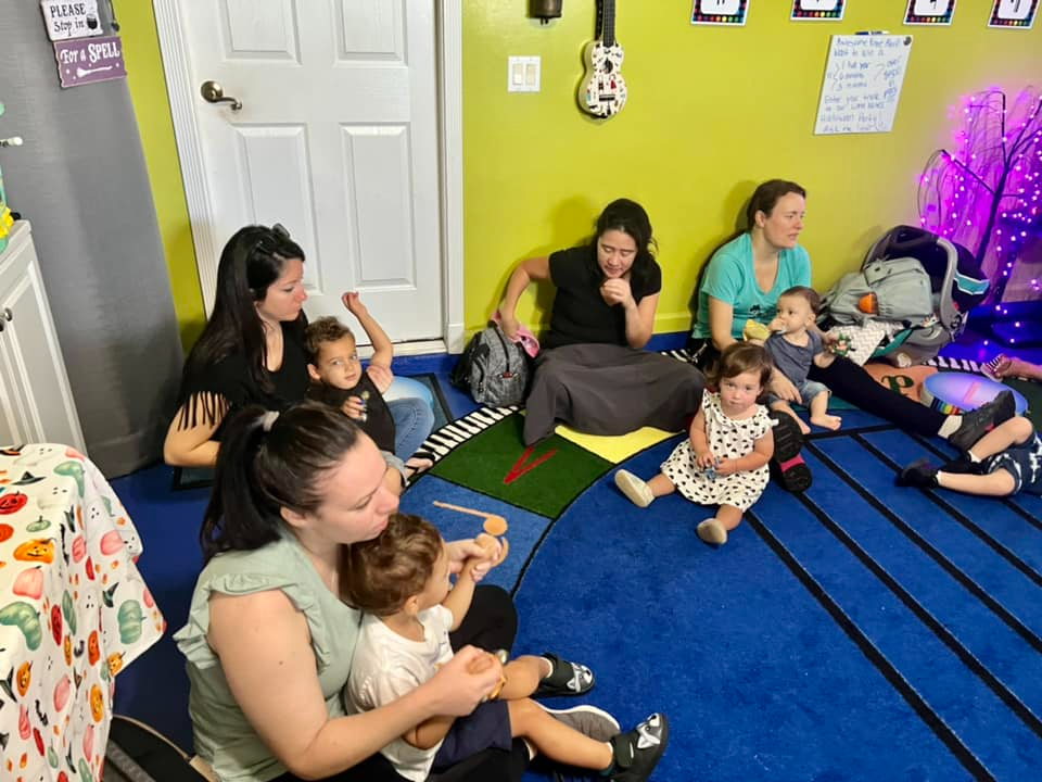a group of people sitting on the floor