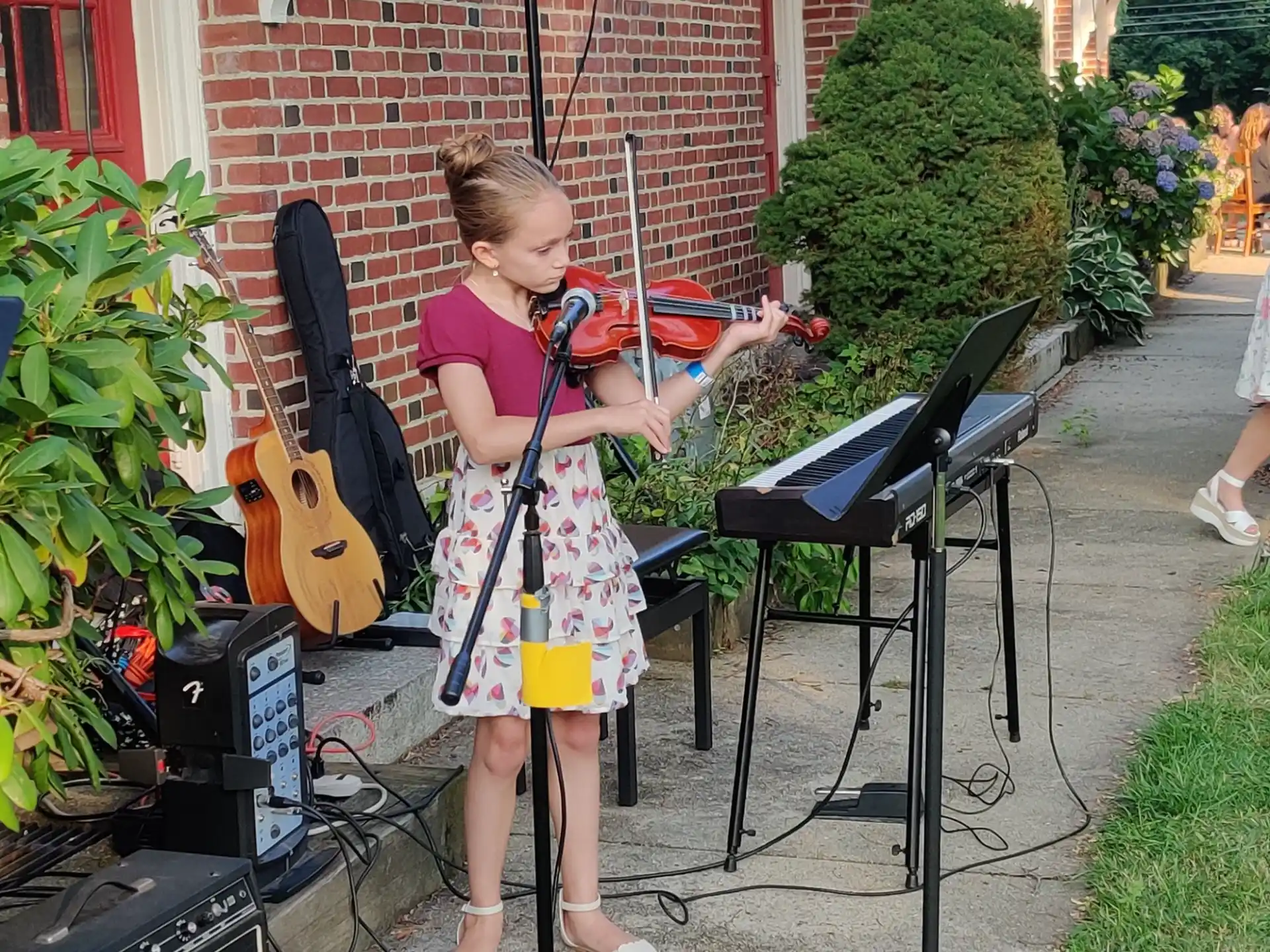 a girl playing a musical instrument
