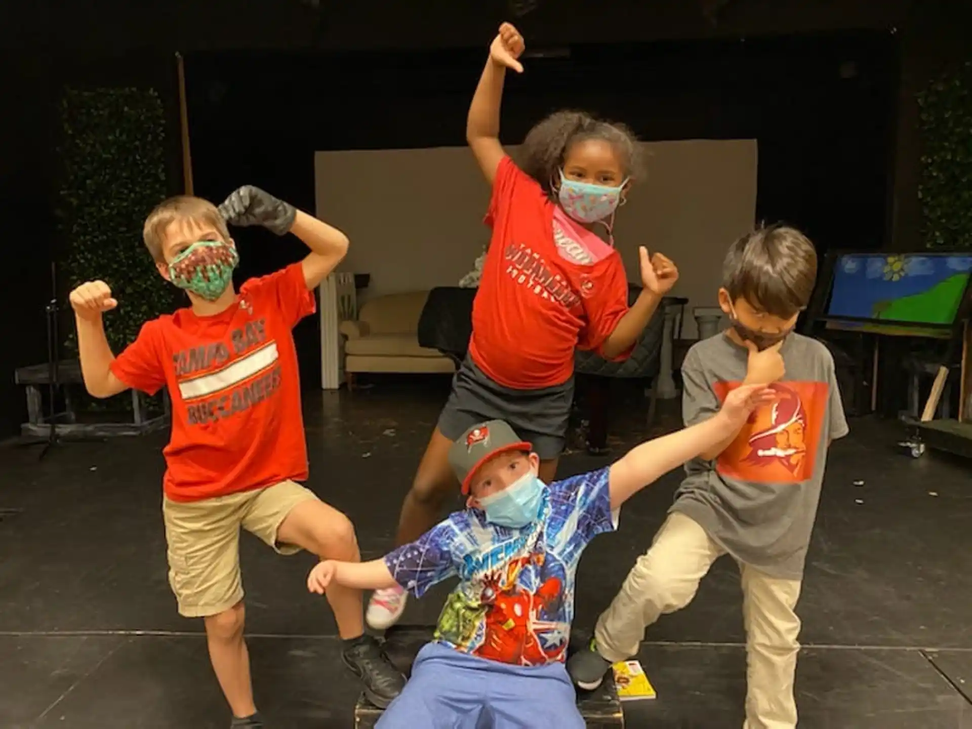 a group of kids wearing face masks