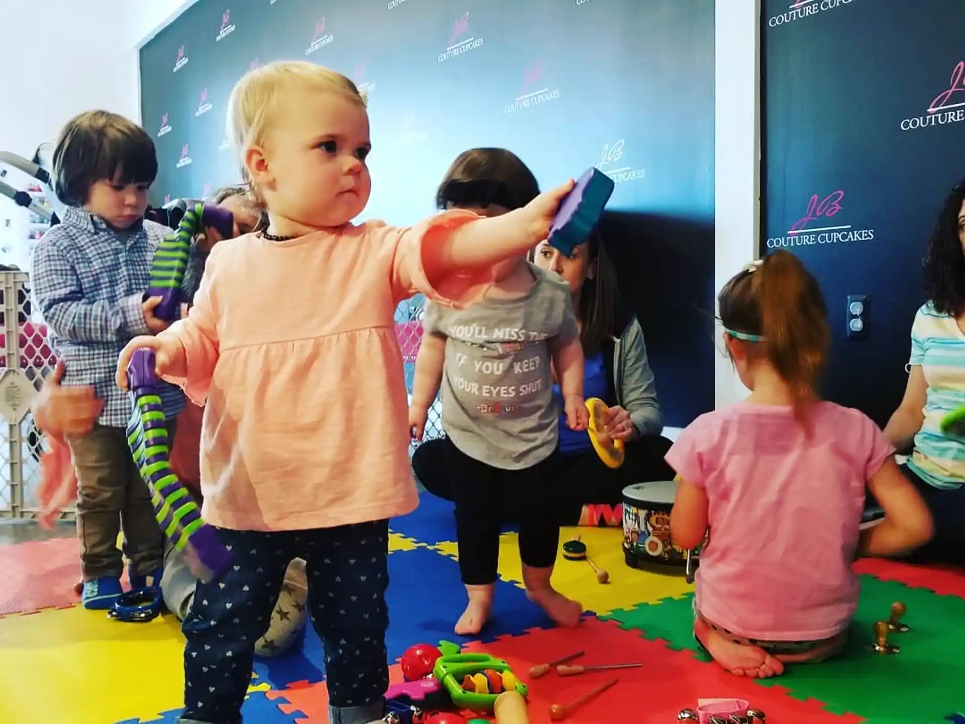 a group of children playing with toys