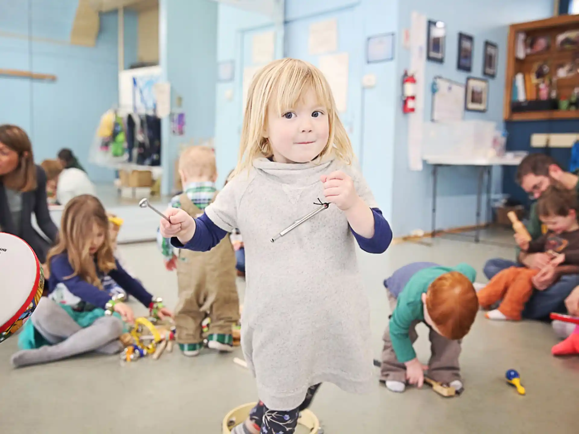 a group of children playing with toys