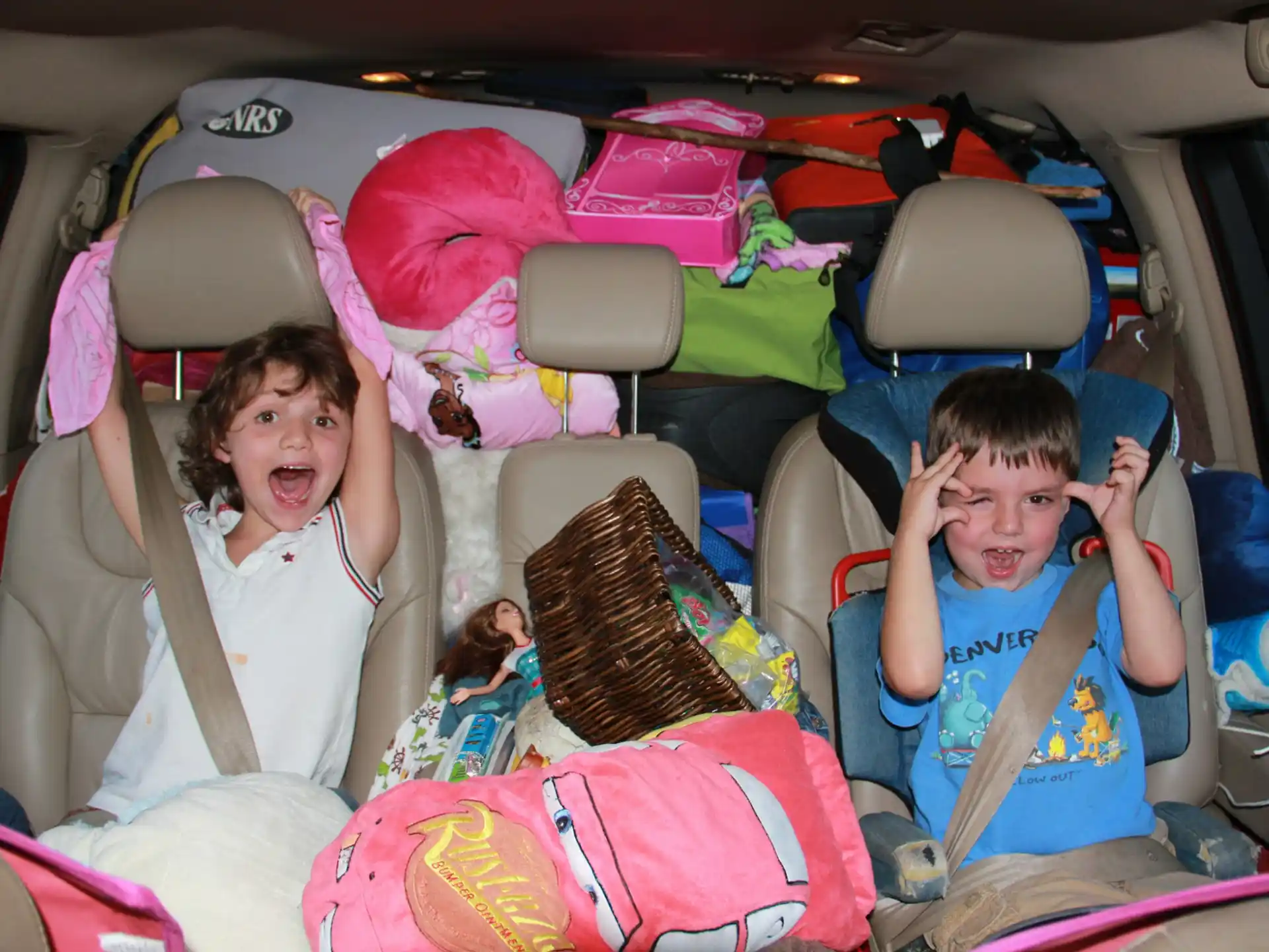 a group of kids in a car