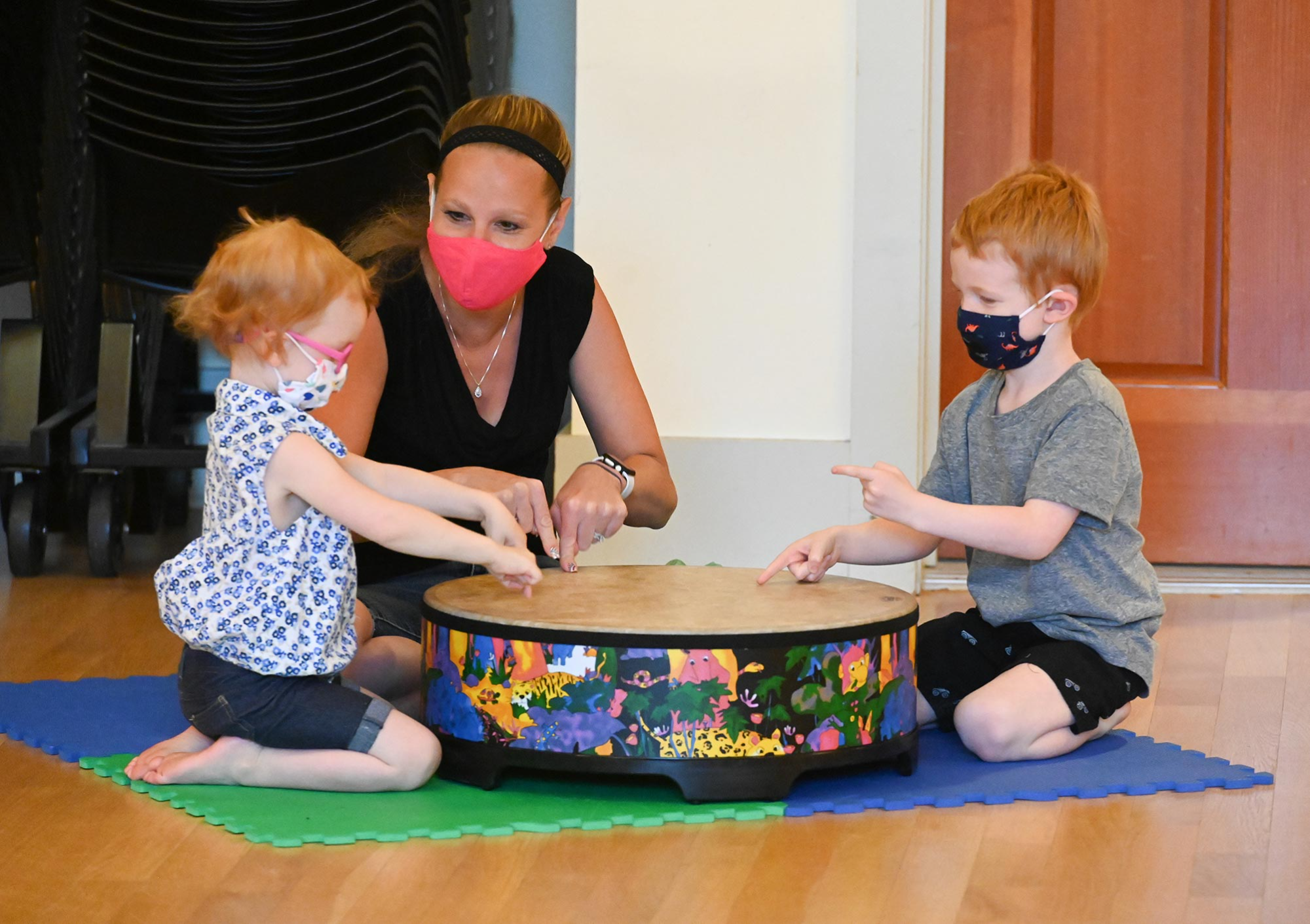 a group of children wearing masks