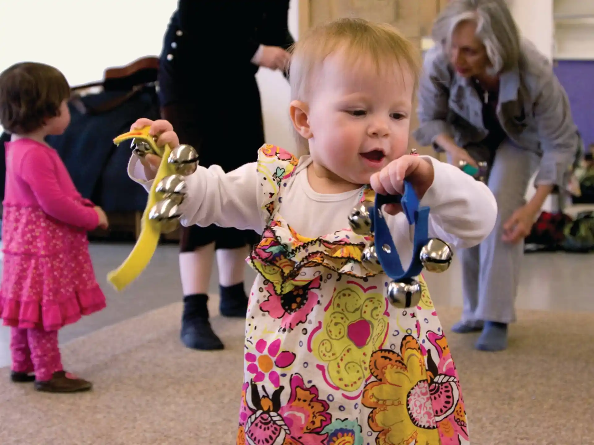 a baby holding a toy
