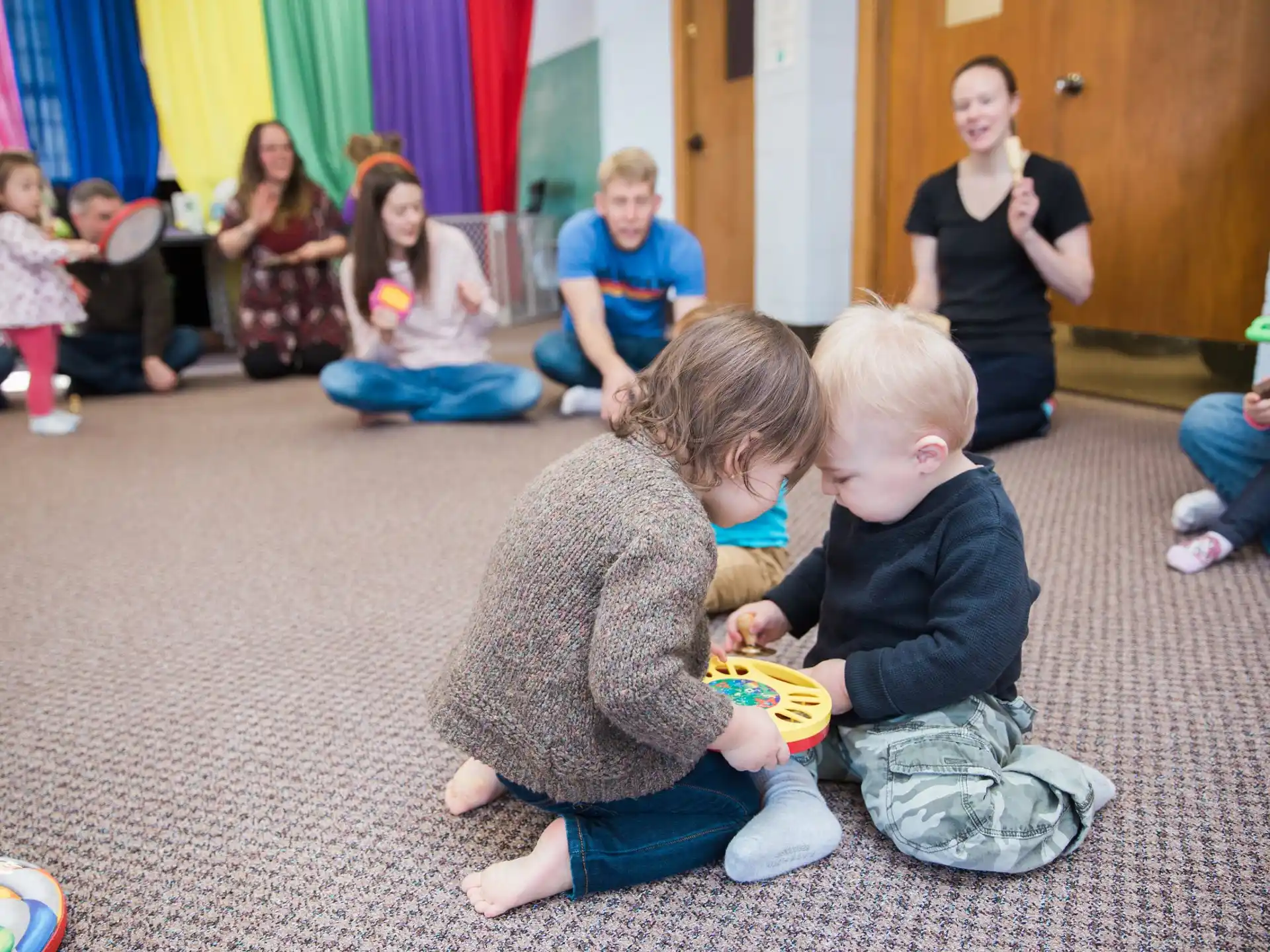 a group of children sitting on the floor