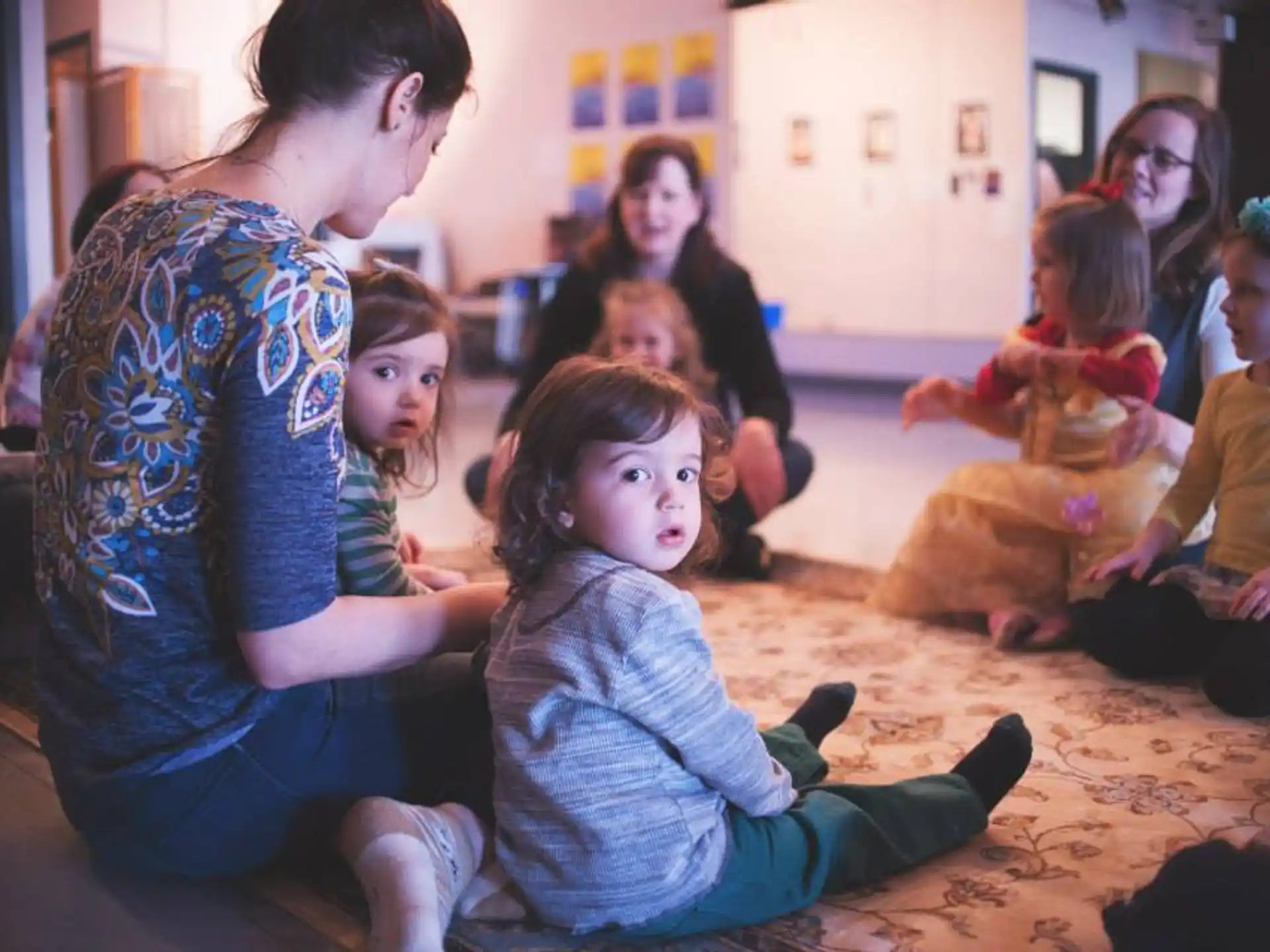 a group of people sitting on the floor