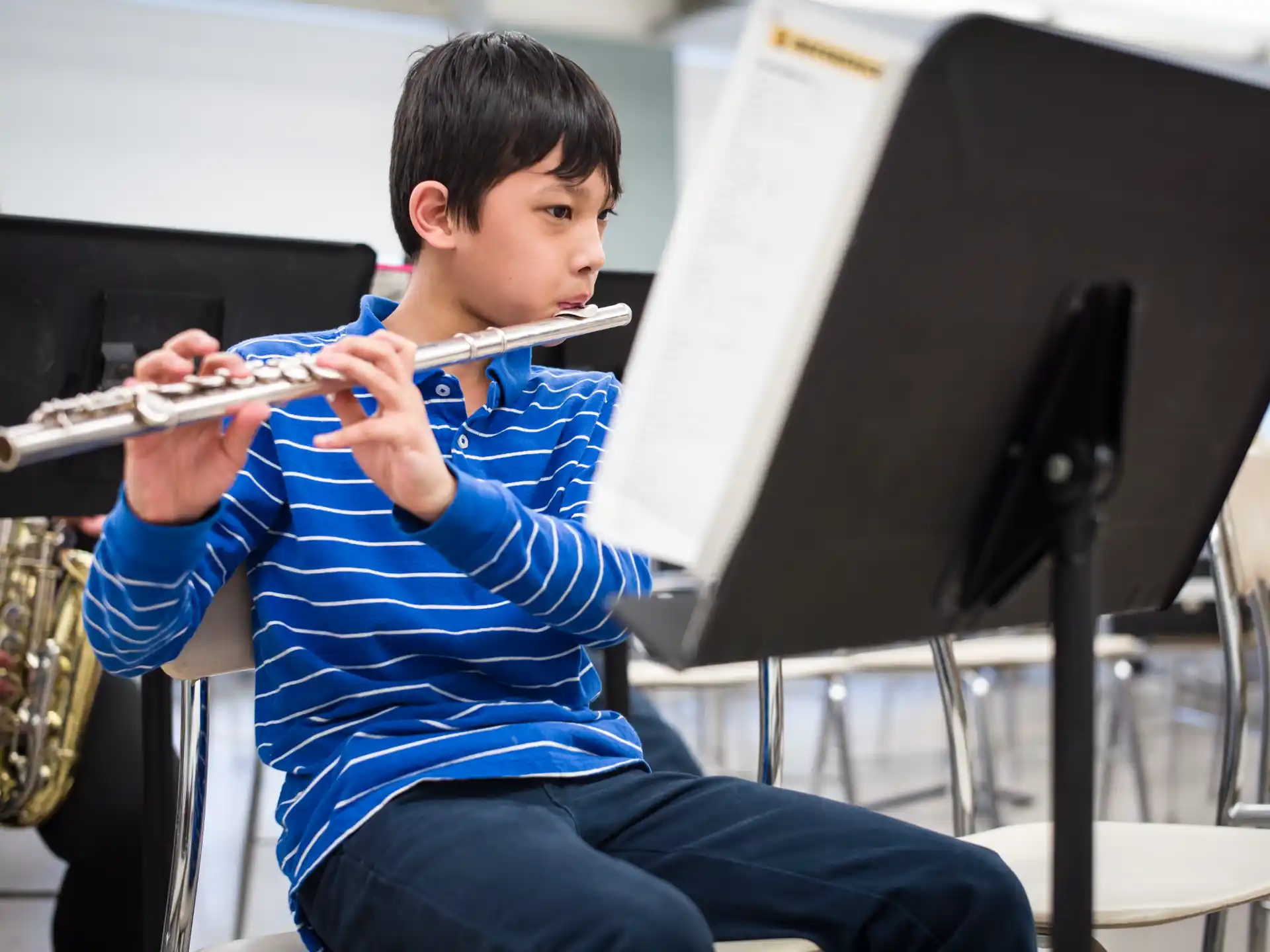 a boy playing a flute