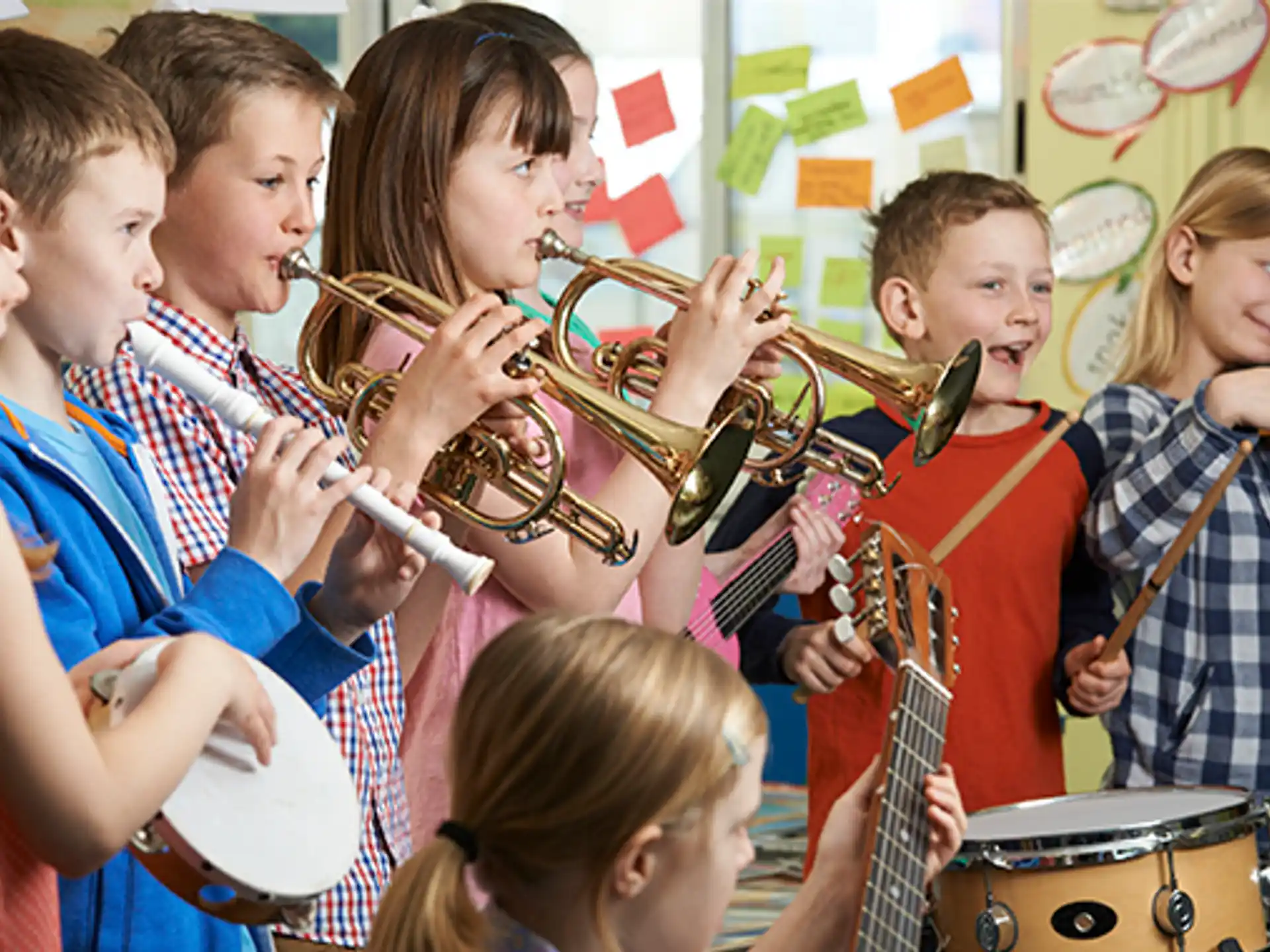 a group of kids playing instruments