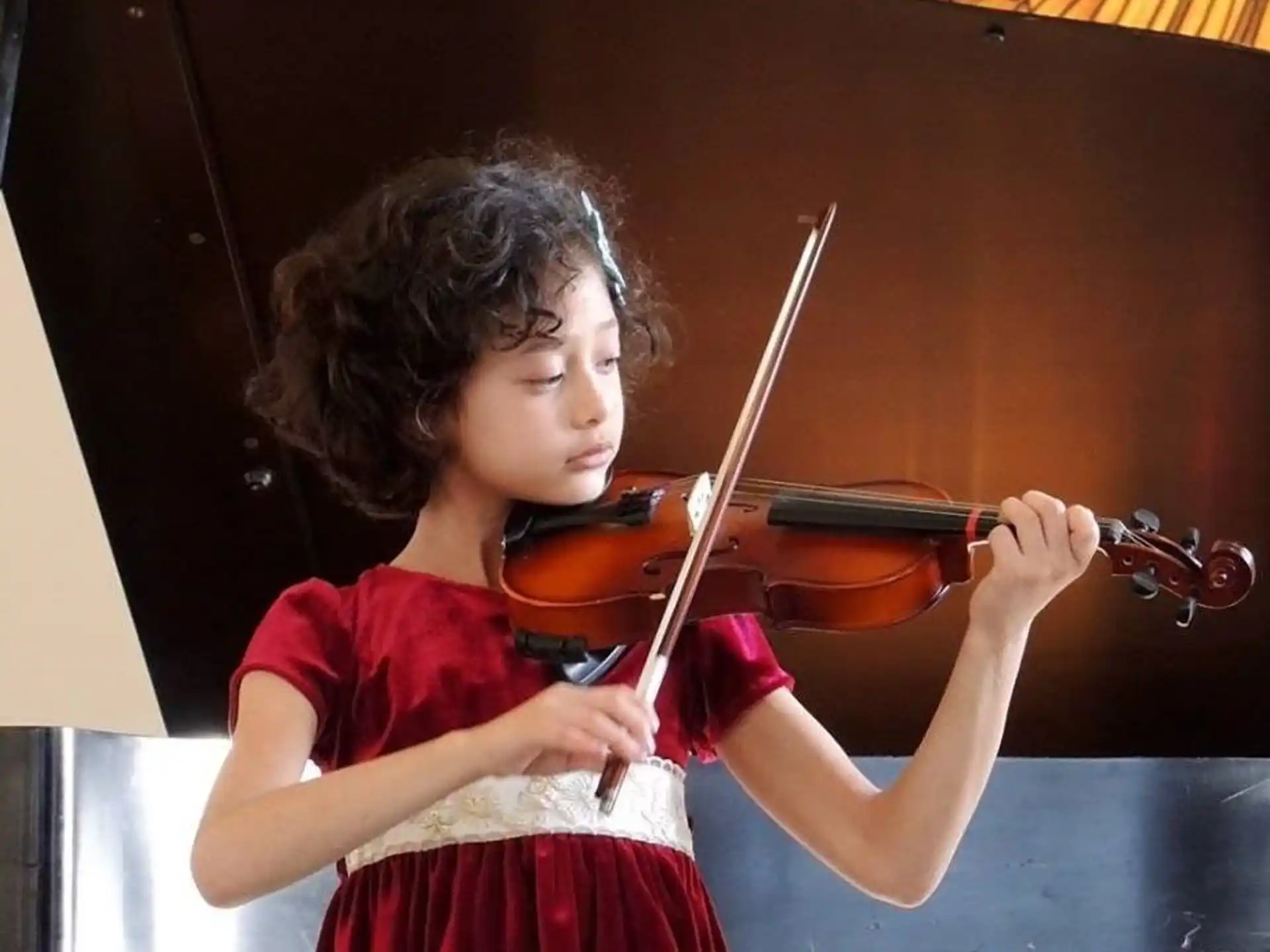a girl playing a violin