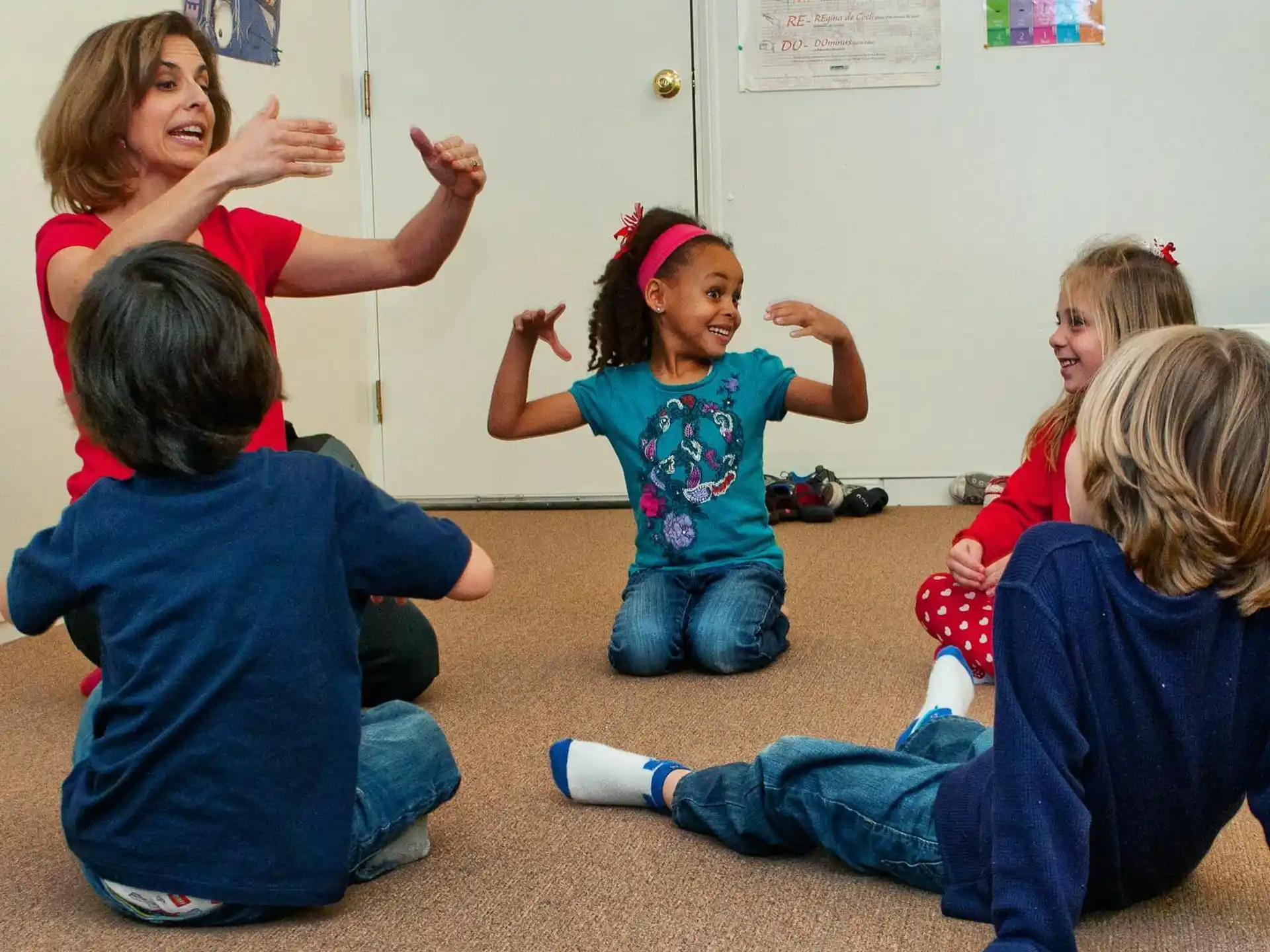 a group of children sitting on the floor