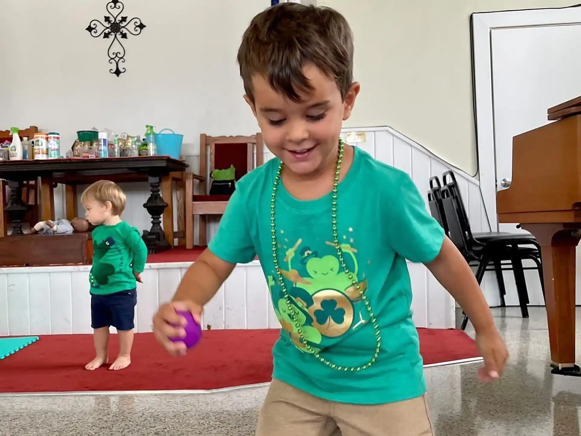 a boy holding a toy