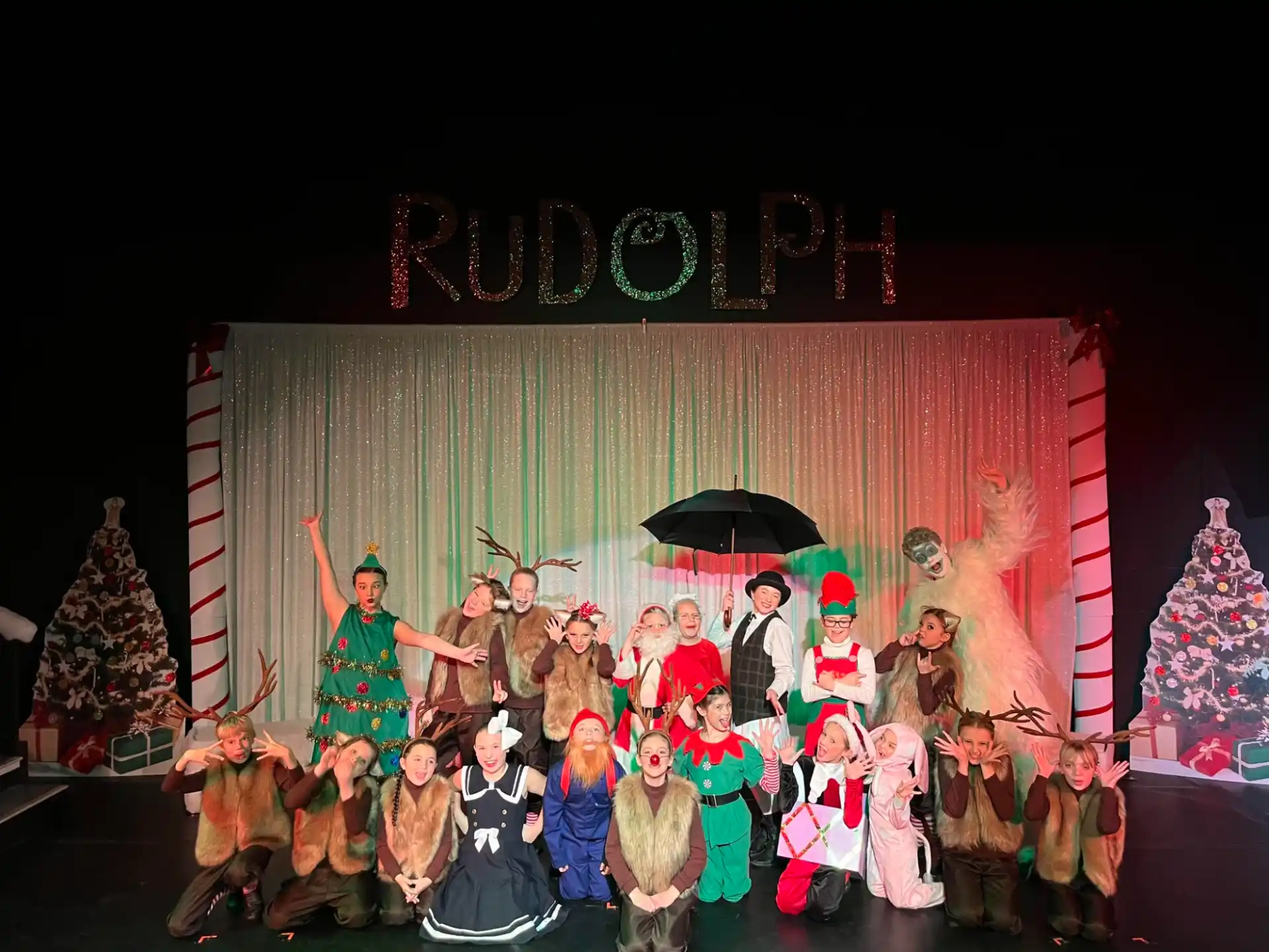 a group of people in clothing posing for the camera