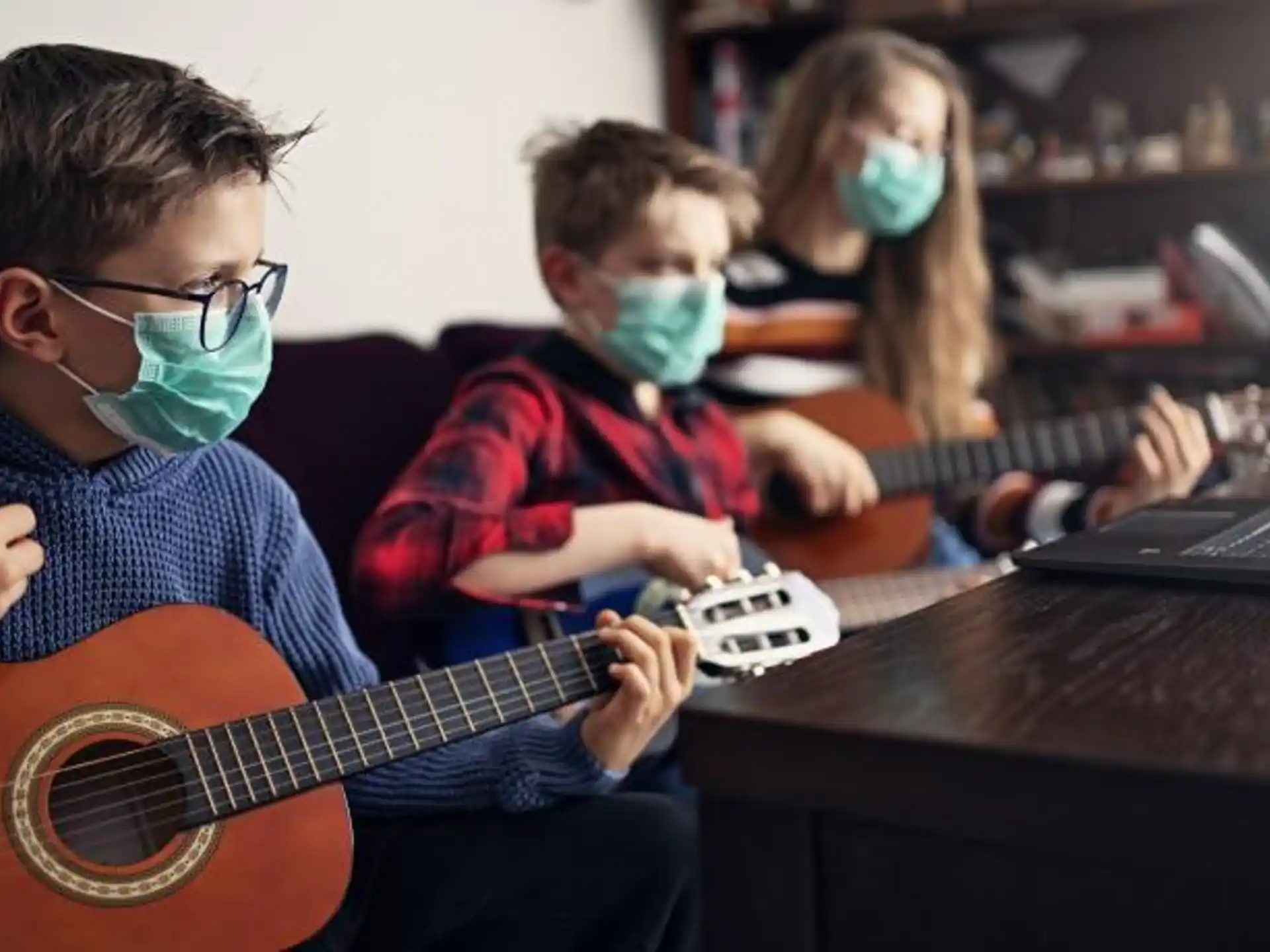 a group of kids playing instruments