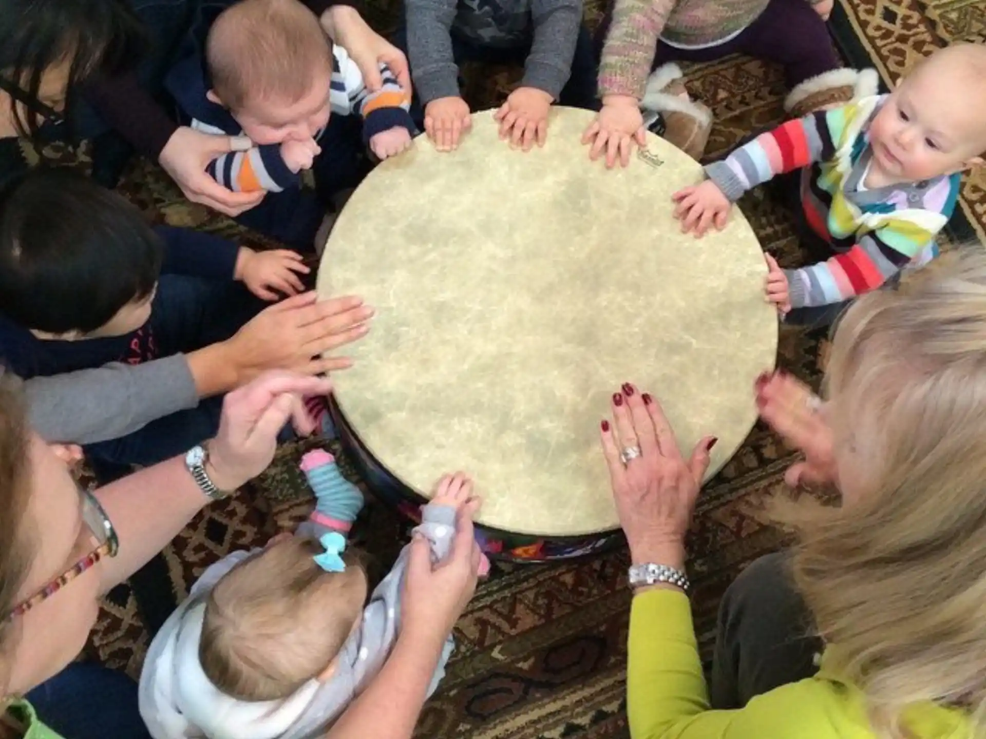 a group of people gathered around a large mushroom