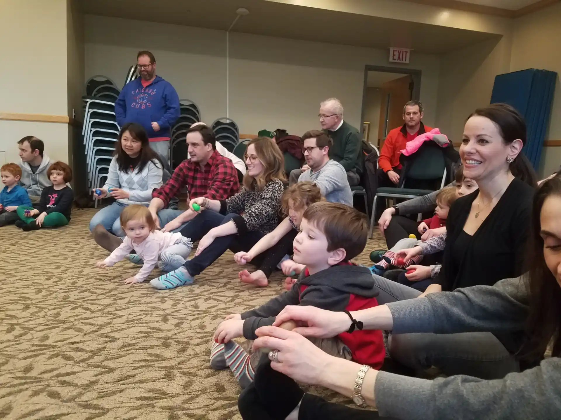 a group of people sitting on the floor