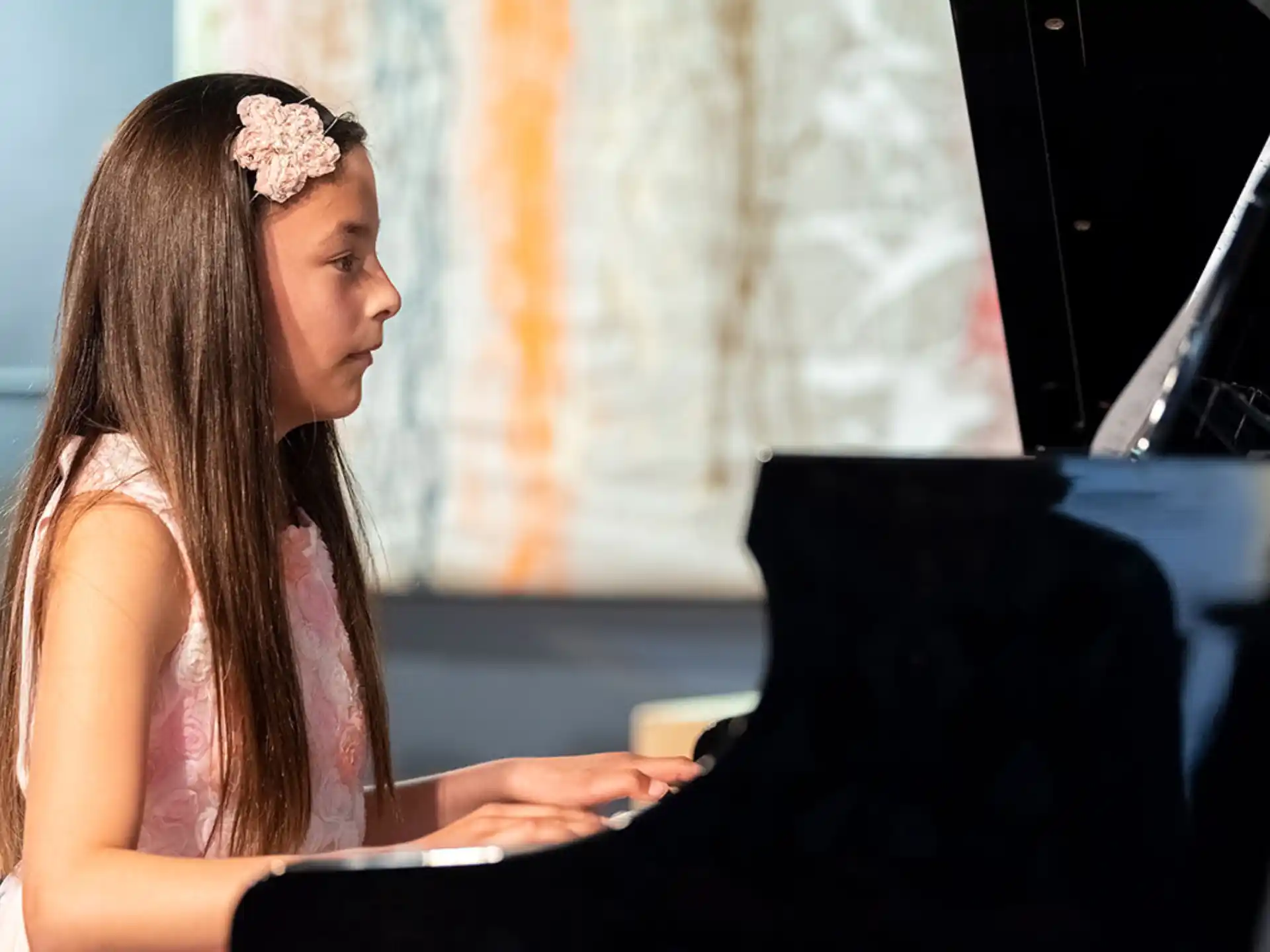 a woman playing a piano