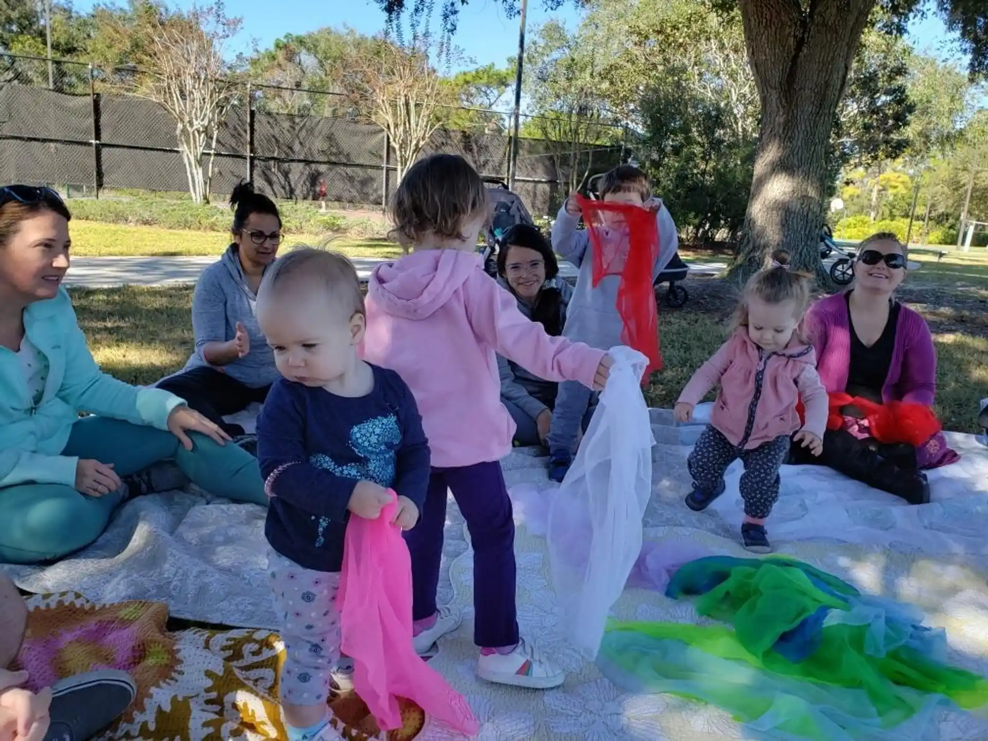 a group of people sitting on the ground