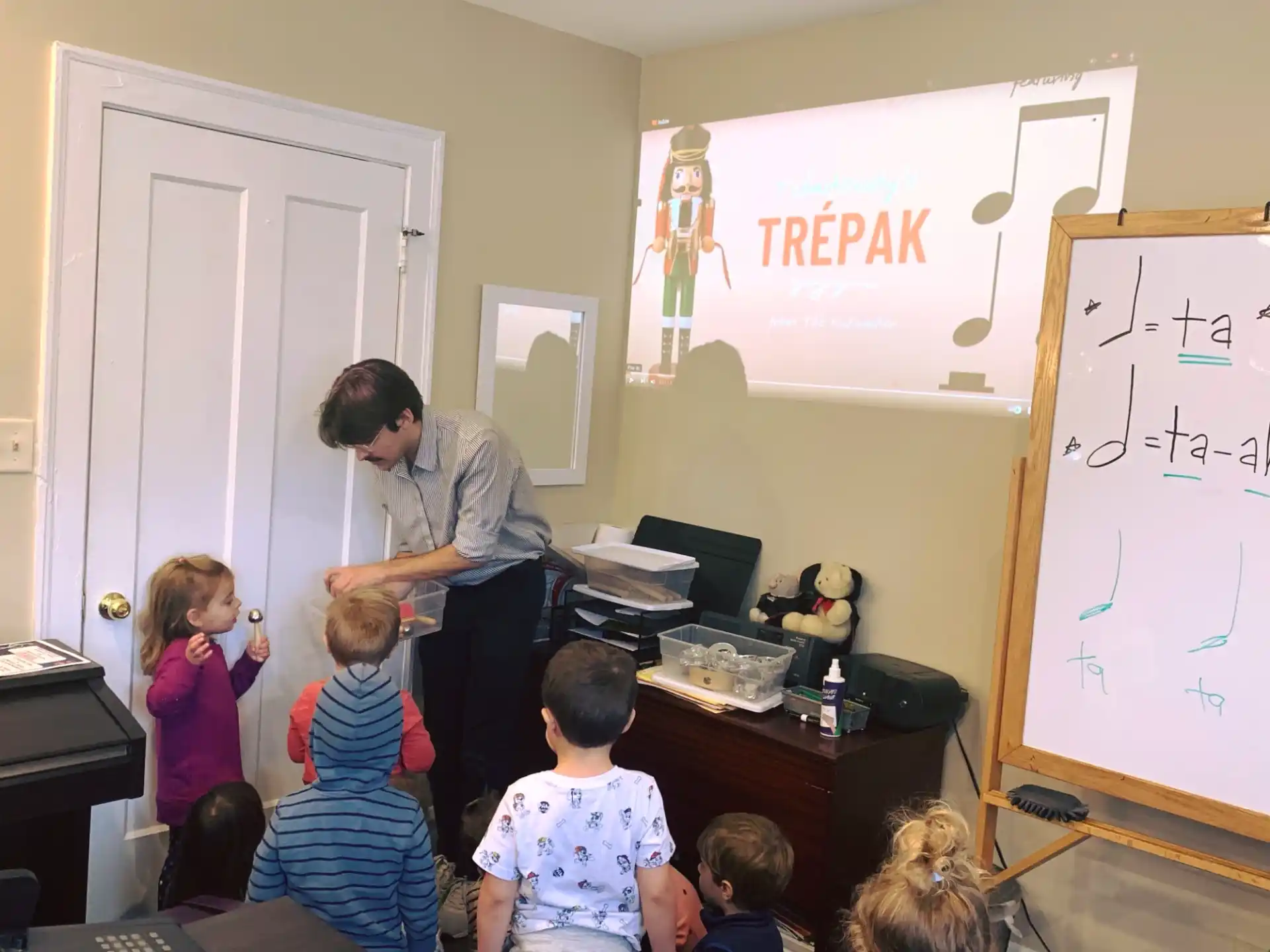 a person teaching children in a classroom