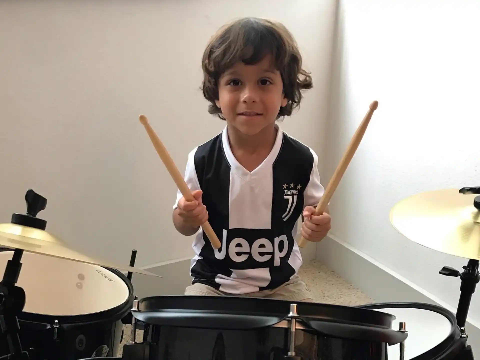 a child playing drums
