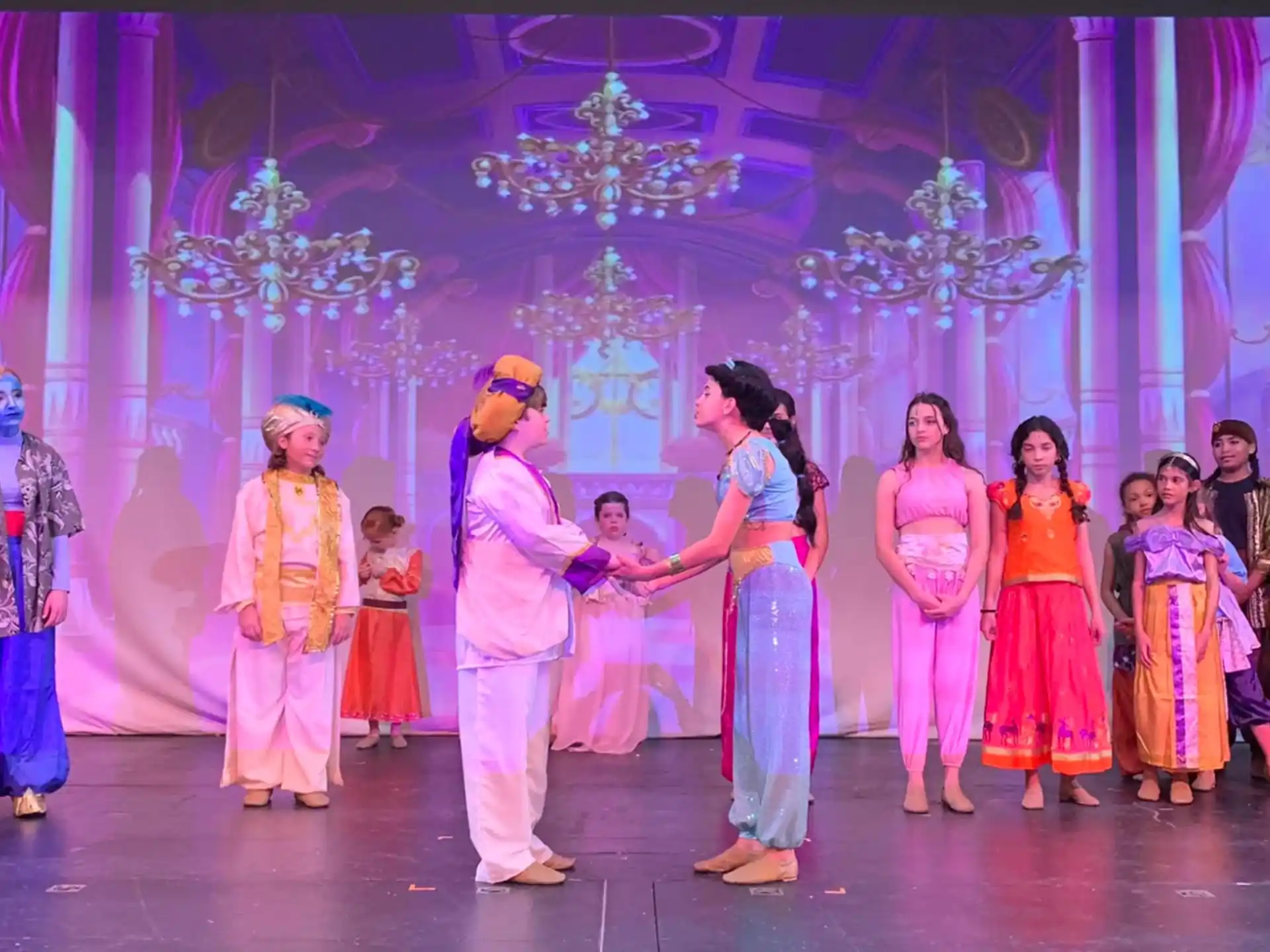 a group of people dancing on a stage