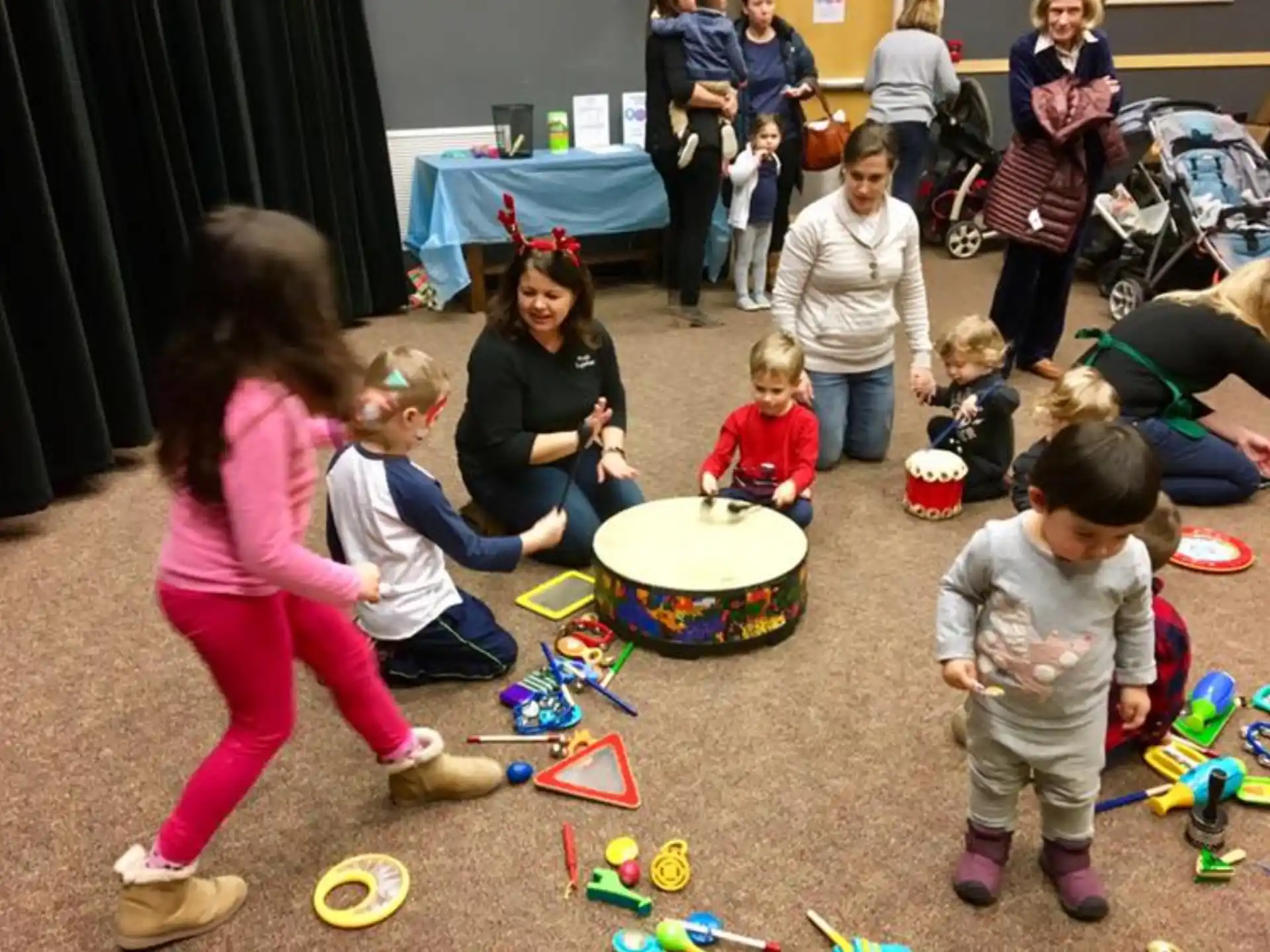 a group of children playing with toys