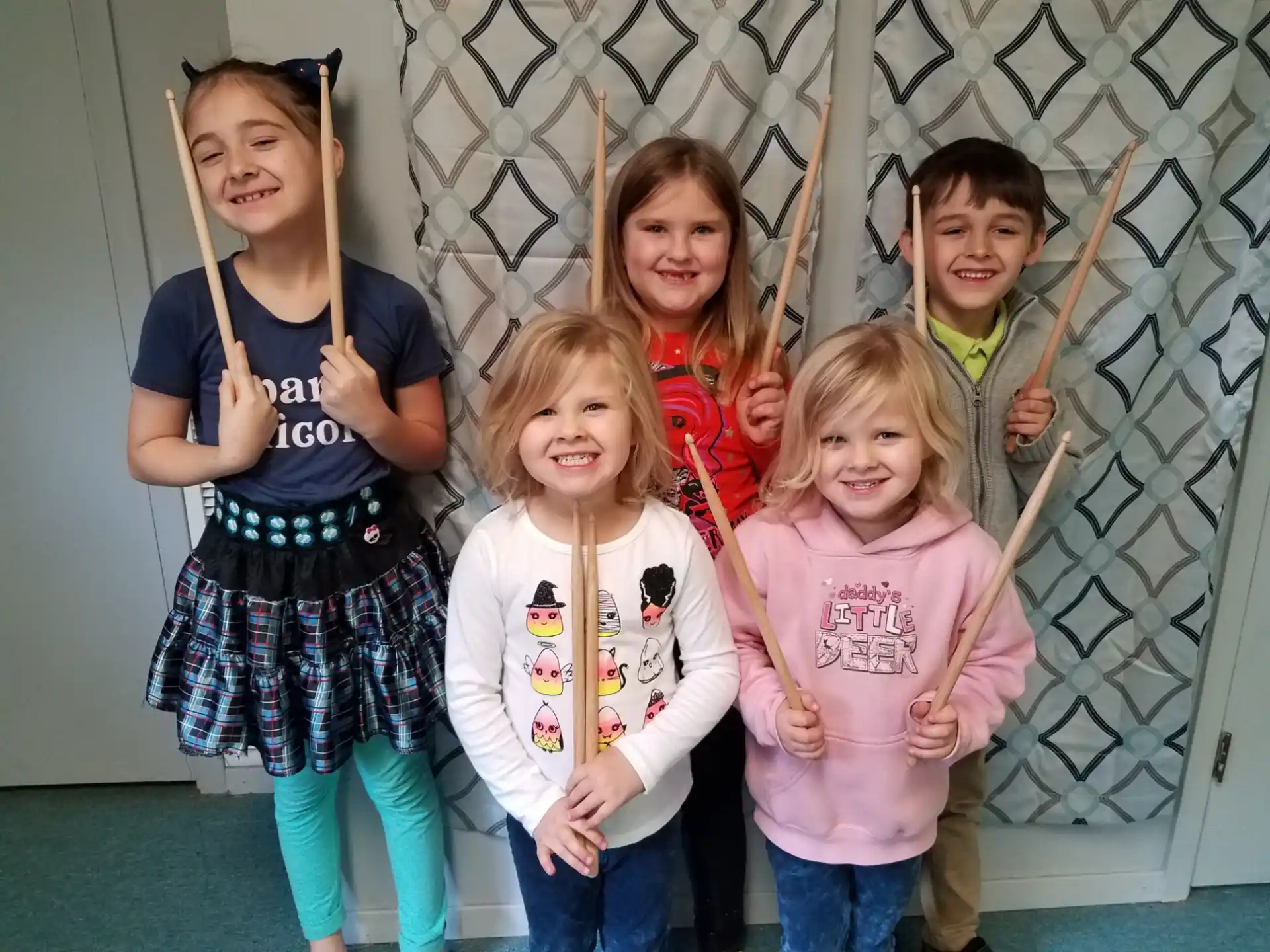 a group of children holding a stick