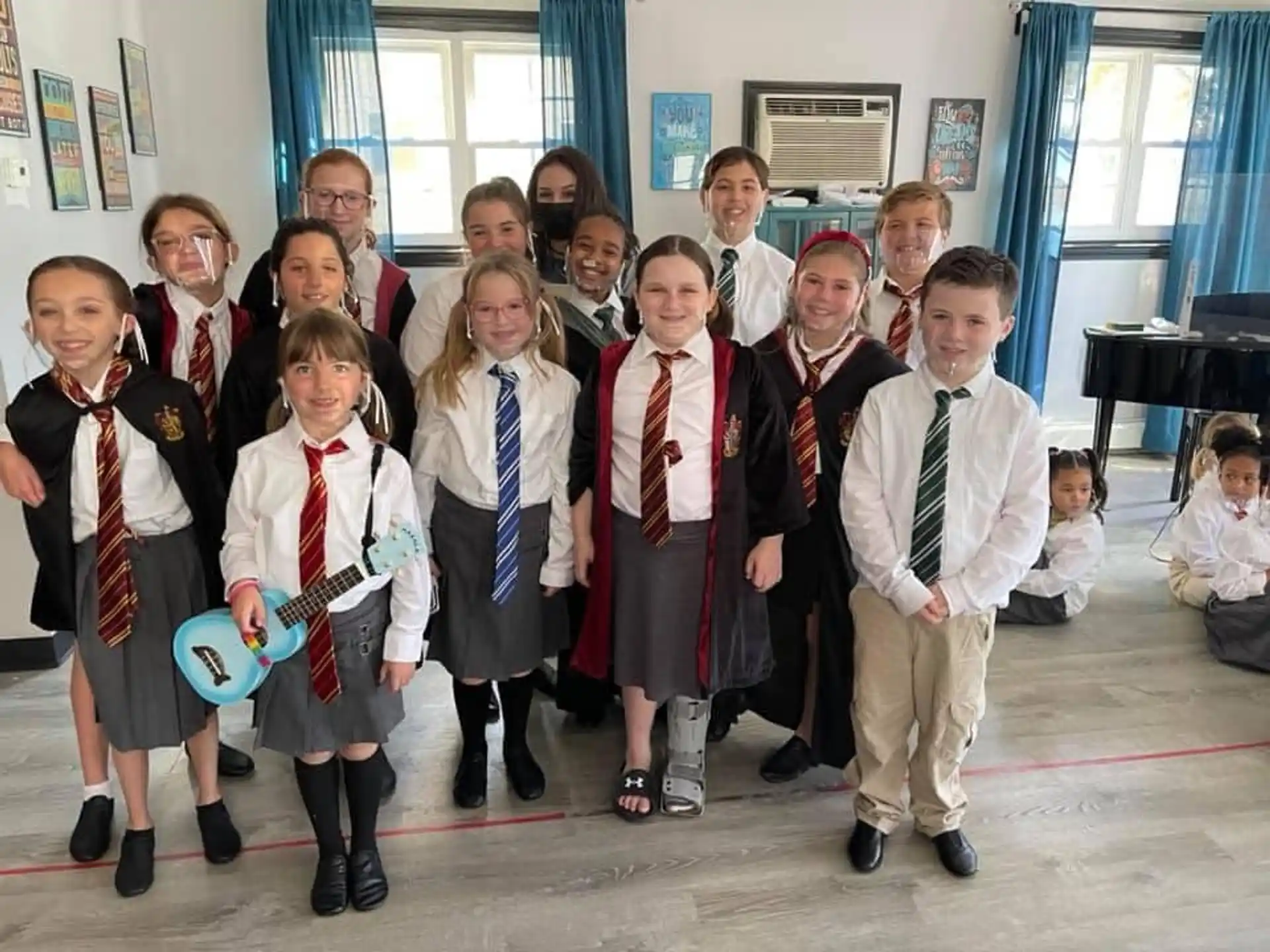 a group of children in school uniforms