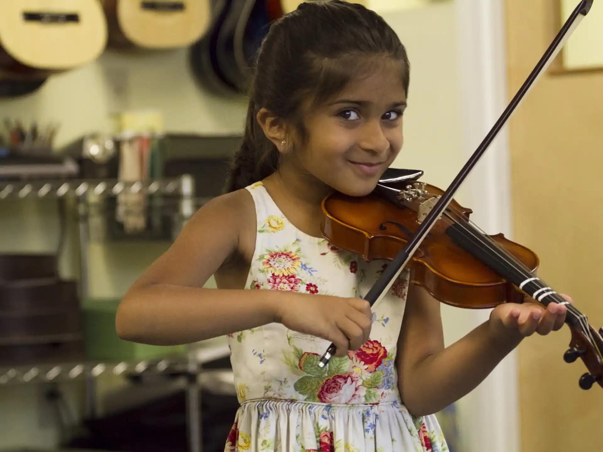 a girl playing a violin
