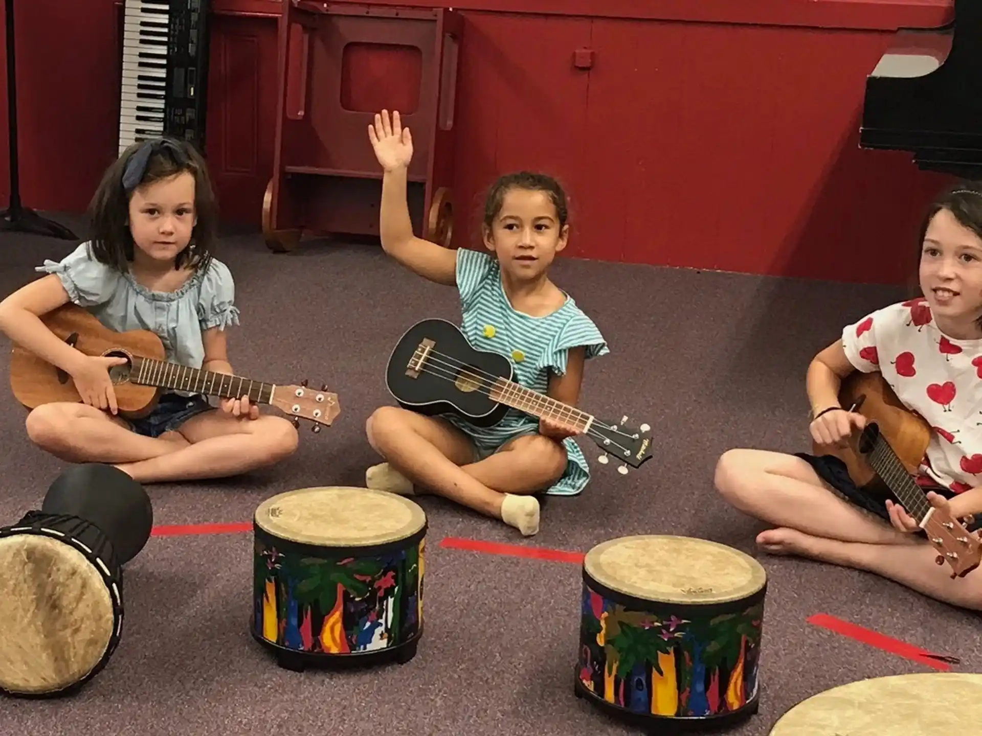 a group of kids playing instruments